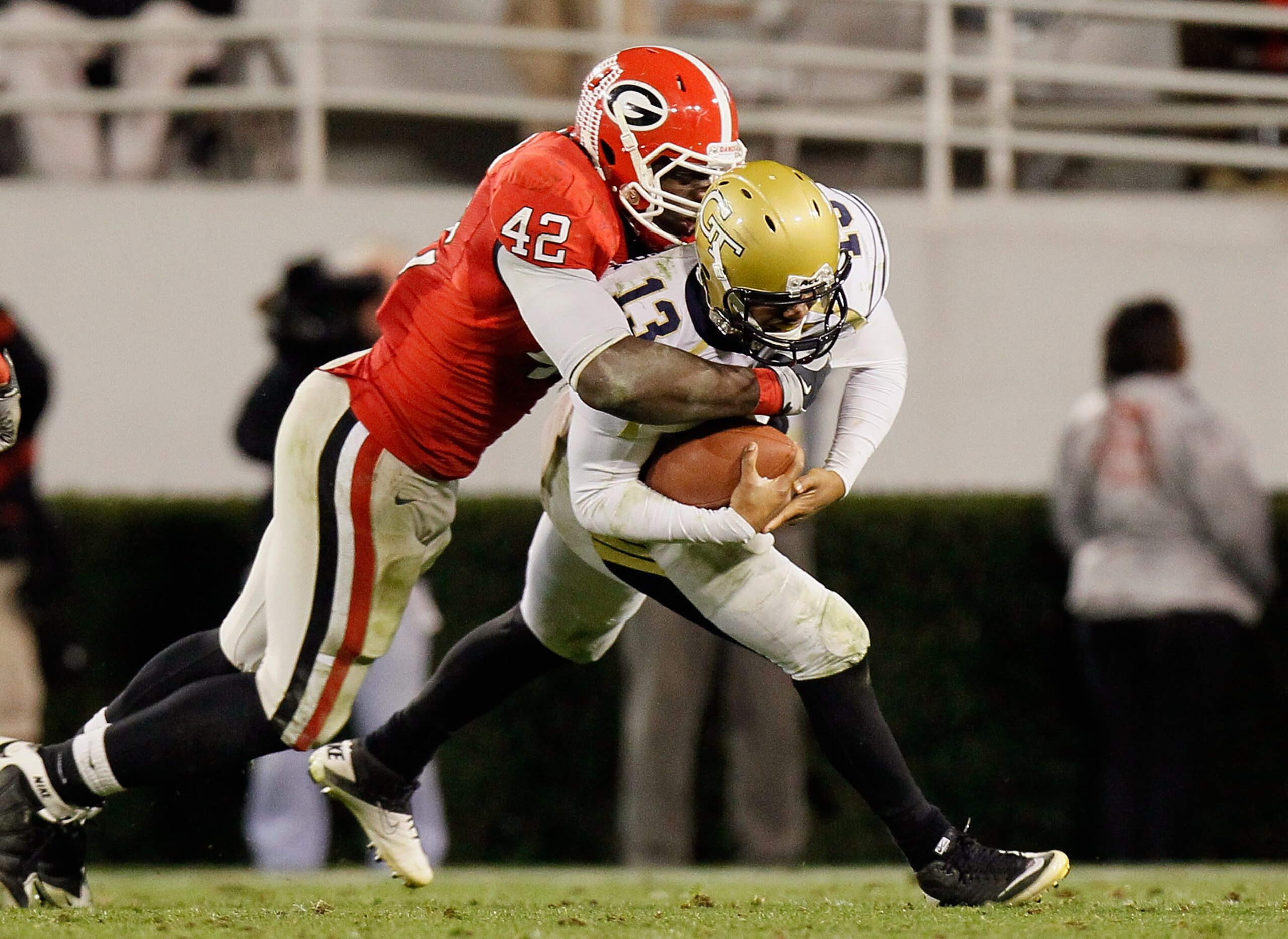 ATHENS, GA - NOVEMBER 27: Justin Houston #42 of the Georgia Bulldogs sacks quarterback Tevin Washington #13 of the Georgia Tech Yellow Jackets at Sanford Stadium on November 27, 2010 in Athens, Georgia. (Photo by Kevin C. Cox/Getty Images) ATHENS, GA - NOVEMBER 27: Justin Houston #42 of the Georgia Bulldogs sacks quarterback Tevin Washington #13 of the Georgia Tech Yellow Jackets at Sanford Stadium on November 27, 2010 in Athens, Georgia. (Photo by Kevin C. Cox/Getty Images)