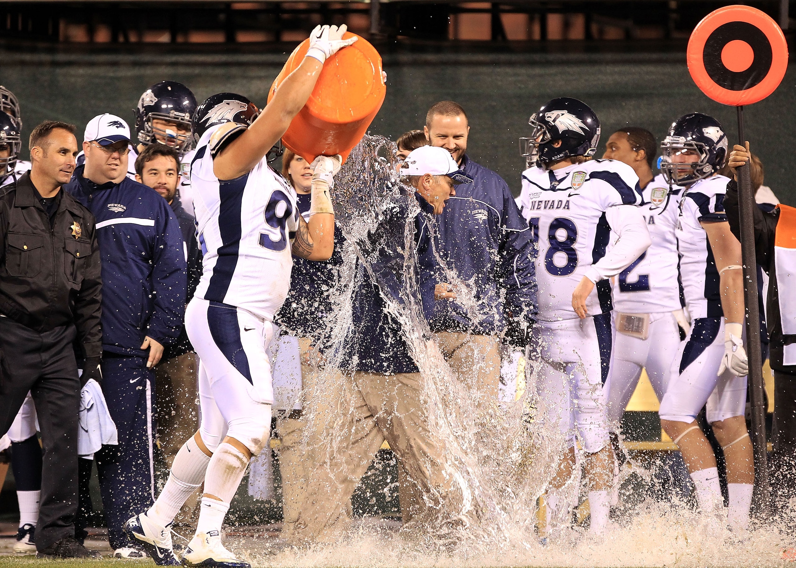 SAN FRANCISCO, CA - JANUARY 09: Head coach Chris Ault of the Nevada Wolf Pack is covered in water by Mike Andrews #92 in the closing minute of their victory over Boston College in the Kraft Fight Hunger Bowl at AT&T Park on January 9, 2011 in San Franci SAN FRANCISCO, CA - JANUARY 09: Head coach Chris Ault of the Nevada Wolf Pack is covered in water by Mike Andrews #92 in the closing minute of their victory over Boston College in the Kraft Fight Hunger Bowl at AT&T Park on January 9, 2011 in San Franci