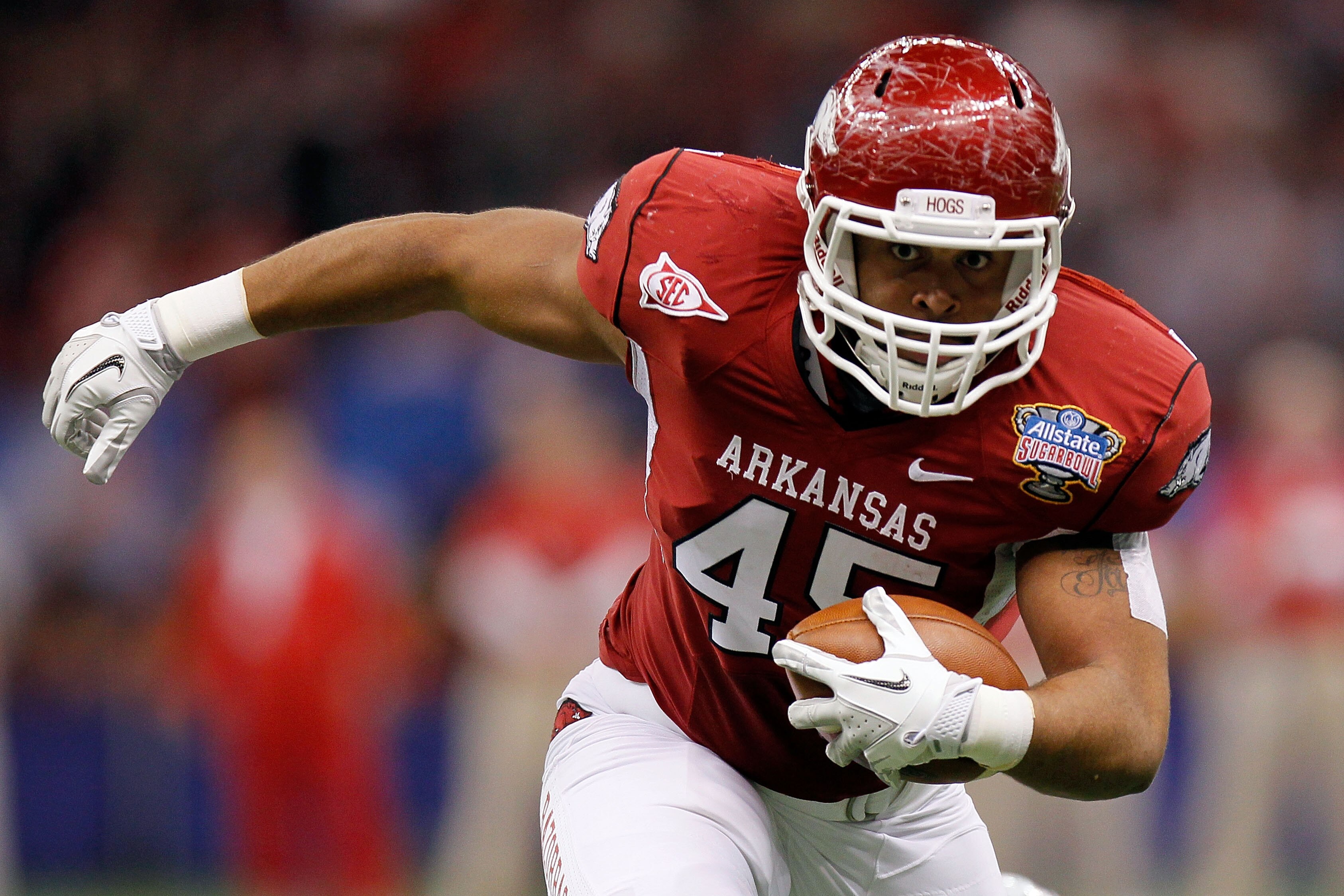 NEW ORLEANS, LA - JANUARY 04:  D.J. Williams #45 of the Arkansas Razorbacks runs after a catch in the first half against the Ohio State Buckeyes during the Allstate Sugar Bowl at the Louisiana Superdome on January 4, 2011 in New Orleans, Louisiana.  (Phot