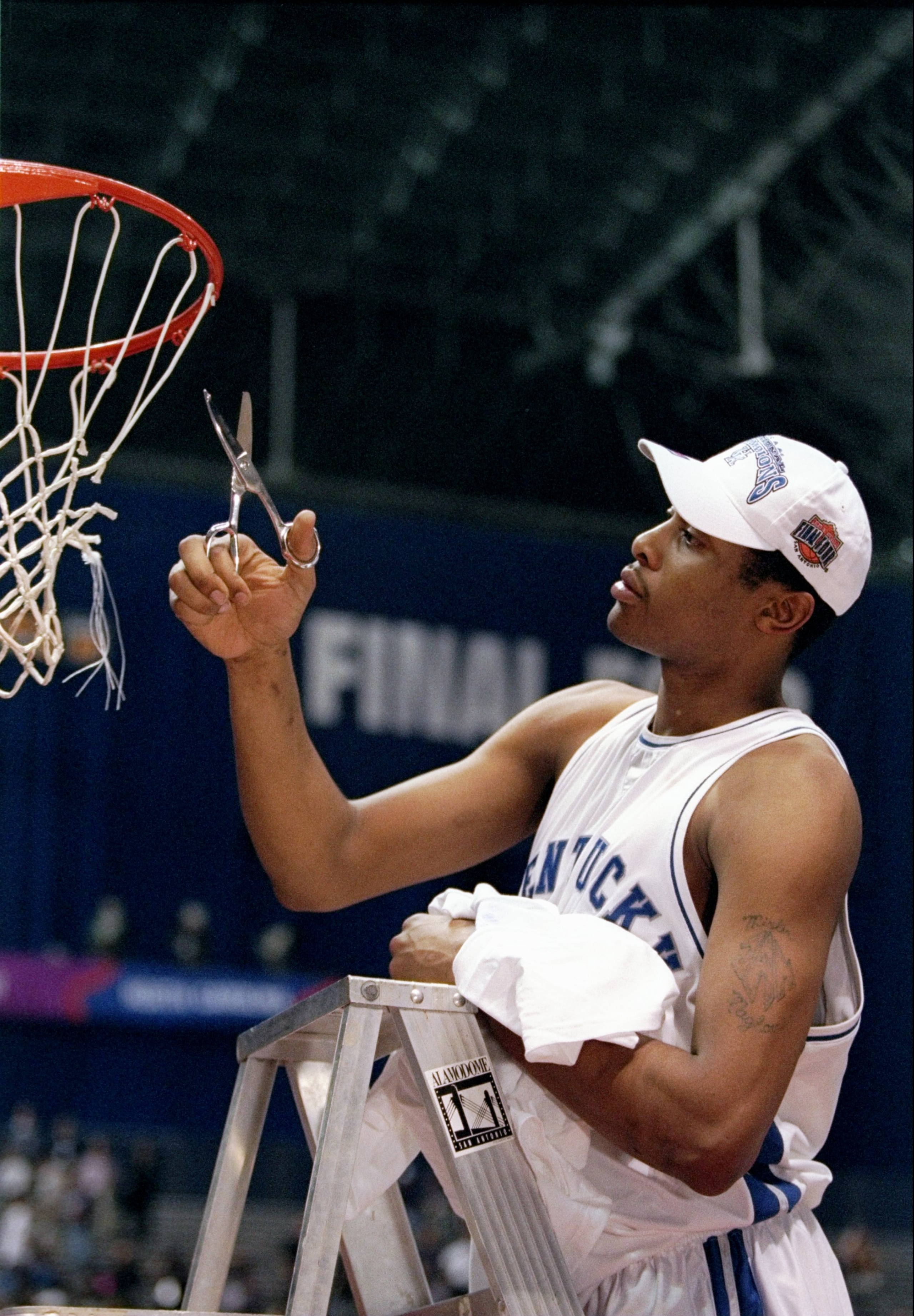 30 Mar 1998:  Jamaal Magloire of the Kentucky Wildcats celebrates a victory over the Utah Utes by cutting down the net during the final game of the NCAA Championship at the Alamodome in San Antonio, Texas. Kentucky defeated Utah 78-69.  Mandatory Credit: