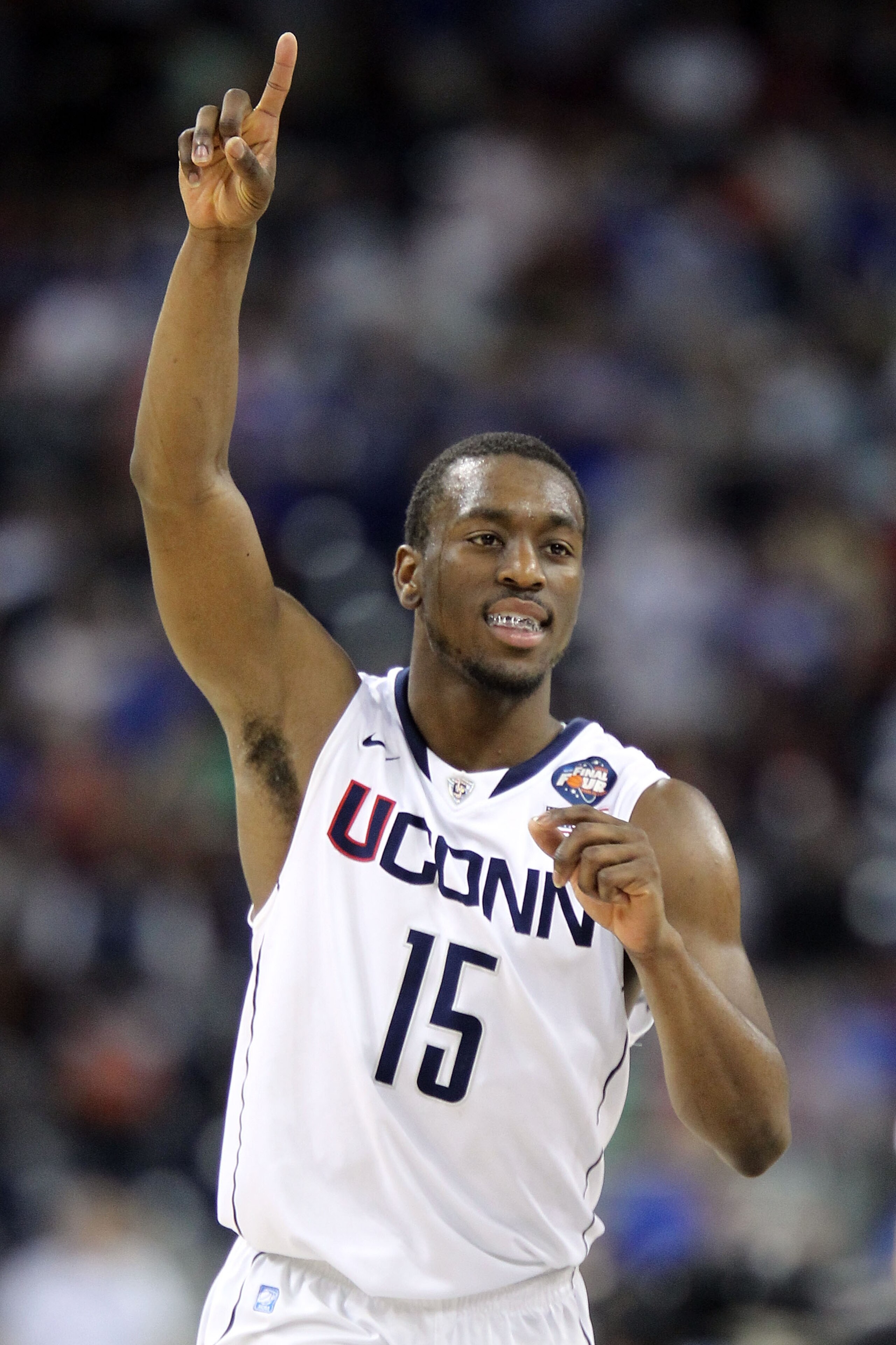 HOUSTON, TX - APRIL 02: Kemba Walker #15 of the Connecticut Huskies reacts towards the end of the game against the Kentucky Wildcats during the National Semifinal game of the 2011 NCAA Division I Men's Basketball Championship at Reliant Stadium on April HOUSTON, TX - APRIL 02: Kemba Walker #15 of the Connecticut Huskies reacts towards the end of the game against the Kentucky Wildcats during the National Semifinal game of the 2011 NCAA Division I Men's Basketball Championship at Reliant Stadium on April