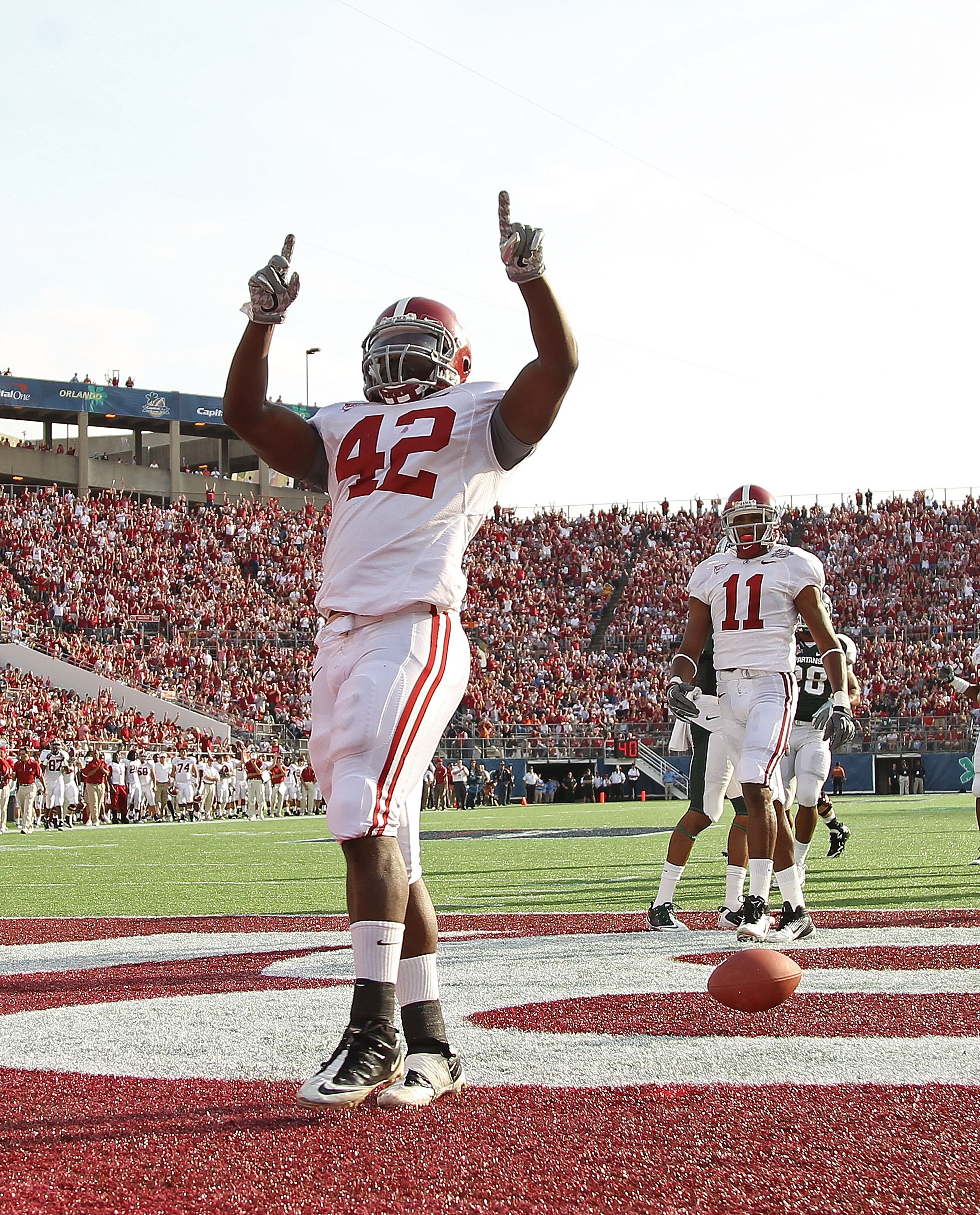 ORLANDO, FL - JANUARY 01:  Eddie Lacy #42 of the Alabama Crimson Tide celebrates after rushing for a touchdown during the Capitol One Bowl against the Michigan State Spartans at the Florida Citrus Bowl on January 1, 2011 in Orlando, Florida.  (Photo by Mi