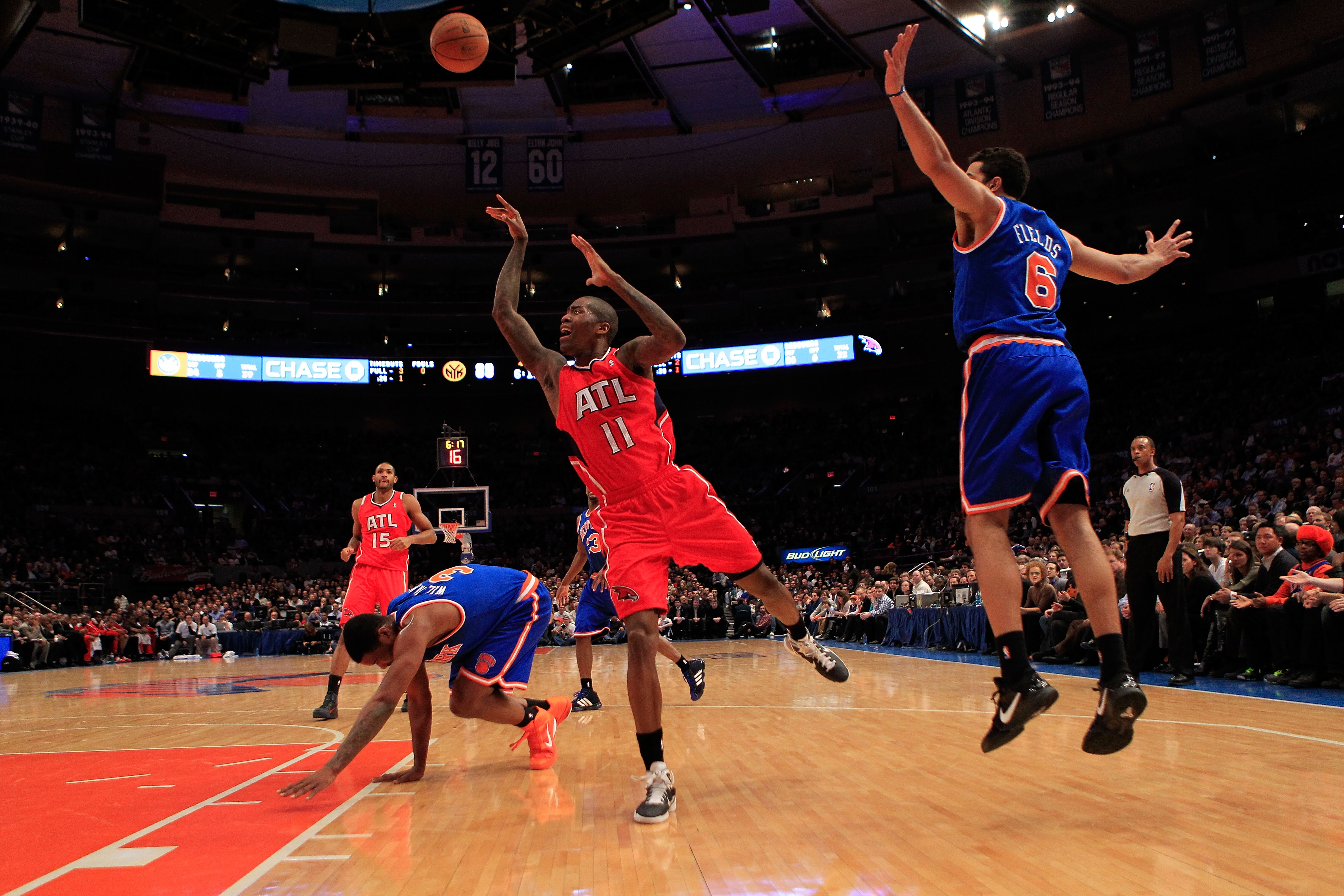 NEW YORK, NY - FEBRUARY 16:  Jamal Crawford #11 of the Atlanta Hawks shoots past Landry Fields #6 of the New York Knicks at Madison Square Garden on February 16, 2011 in New York City. NOTE TO USER: User expressly acknowledges and agrees that, by download