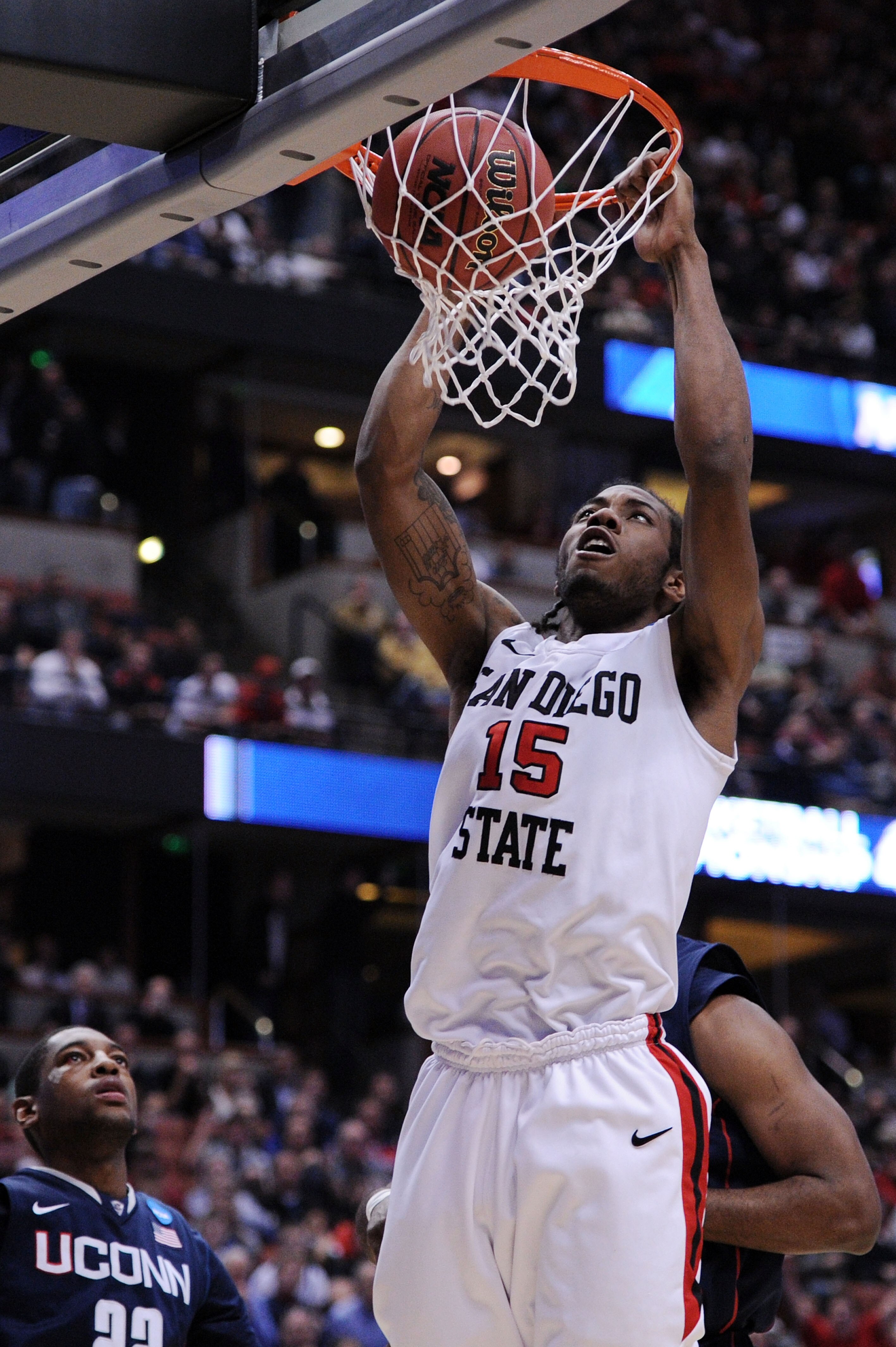 ANAHEIM, CA - MARCH 24:  Kawhi Leonard #15 of the San Diego State Aztecs dunks the ball against the Connecticut Huskies during the west regional semifinal of the 2011 NCAA men's basketball tournament at the Honda Center on March 24, 2011 in Anaheim, Calif