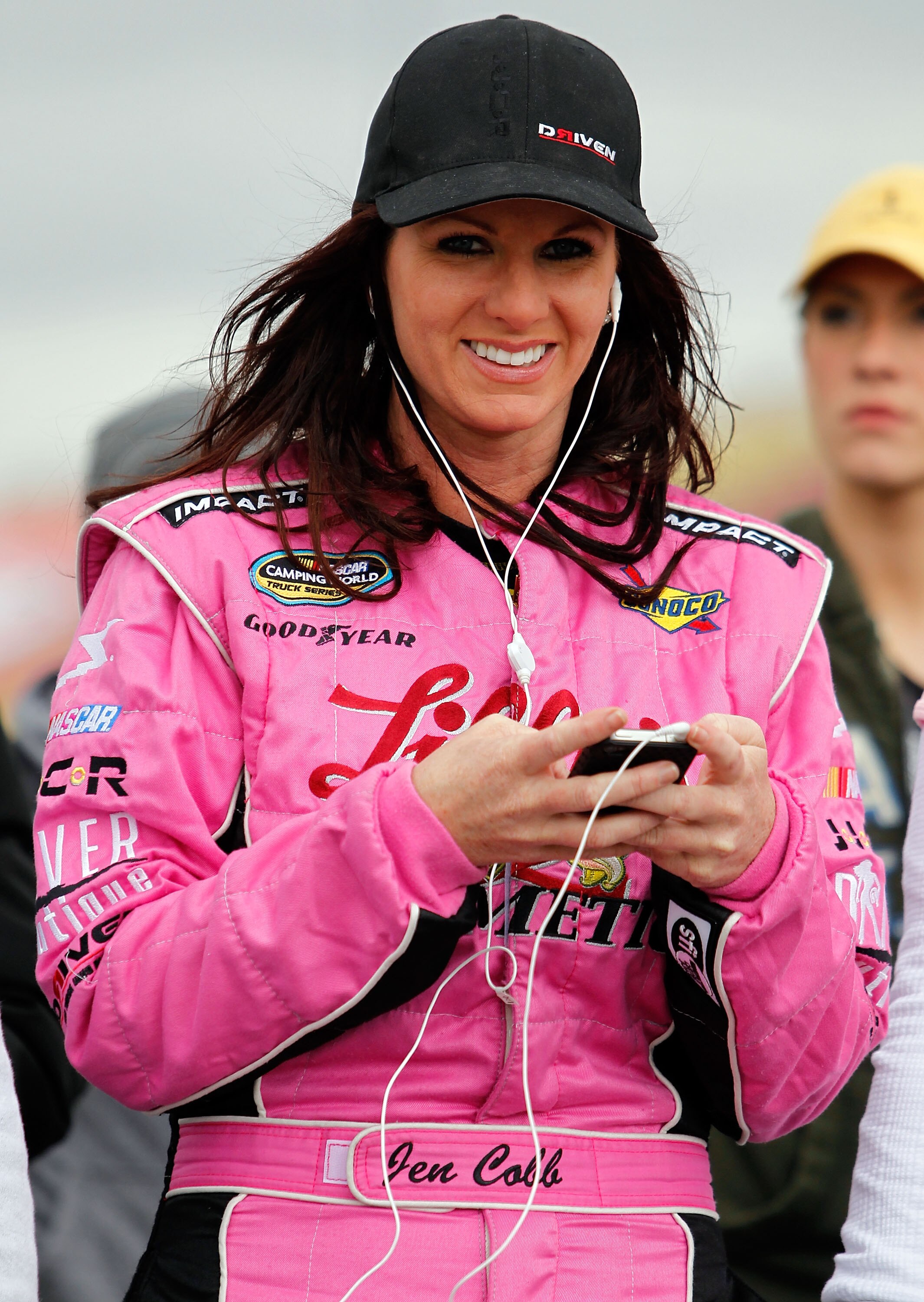 FONTANA, CA - MARCH 26:  Jennifer Jo Cobb, driver of the #41 GreetingsExpress.com Ford, walks on pit road prior to the NASCAR Nationwide Series Royal Purple 300 at Auto Club Speedway on March 26, 2011 in Fontana, California.  (Photo by Tom Pennington/Gett