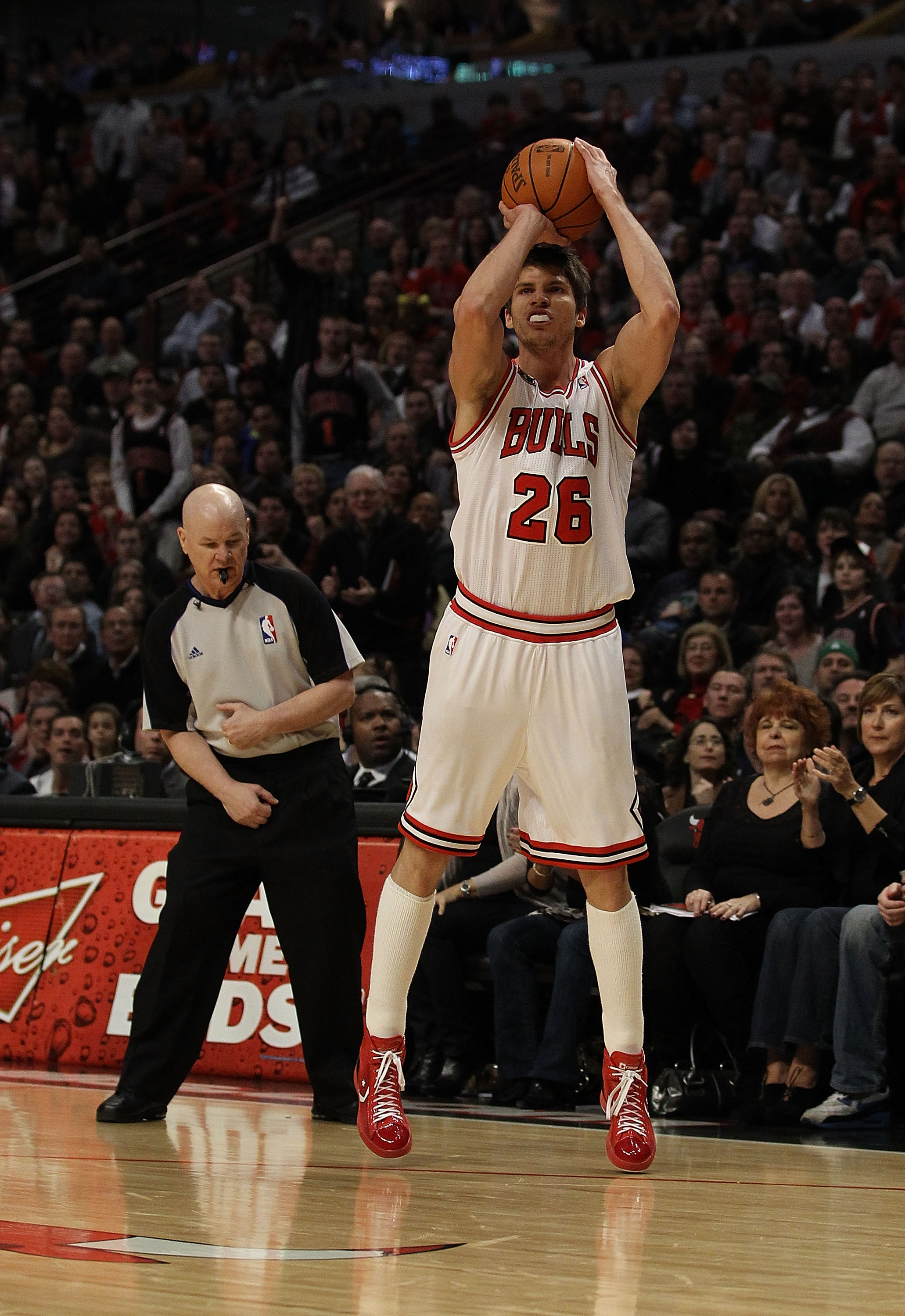 CHICAGO, IL - MARCH 25: Referee Joey Crawford #17 looks to see if Kyle Korver #26 of the Chicago Bulls successfully shoots a 3 point shot against the Memphis Grizzlies at the United Center on March 25, 2011 in Chicago, Illinois. The Bulls defeated the Gri