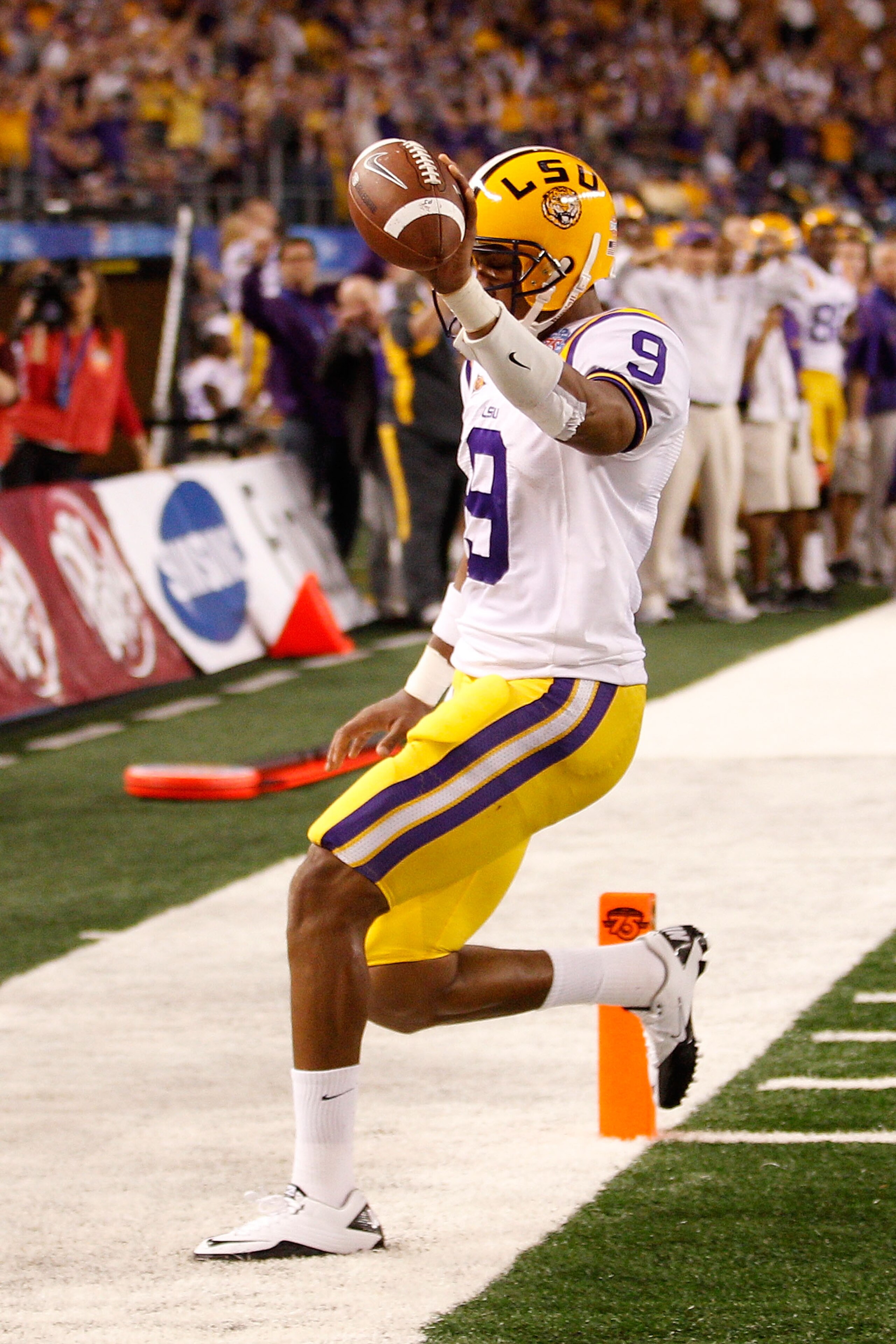 ARLINGTON, TX - JANUARY 07:  Jordan Jefferson #9 of the Louisiana State University Tigers celebrates after scoring a touchdown during the game against the Texas A&M Aggies during the AT&T Cotton Bowl at Cowboys Stadium on January 7, 2011 in Arlington, Tex