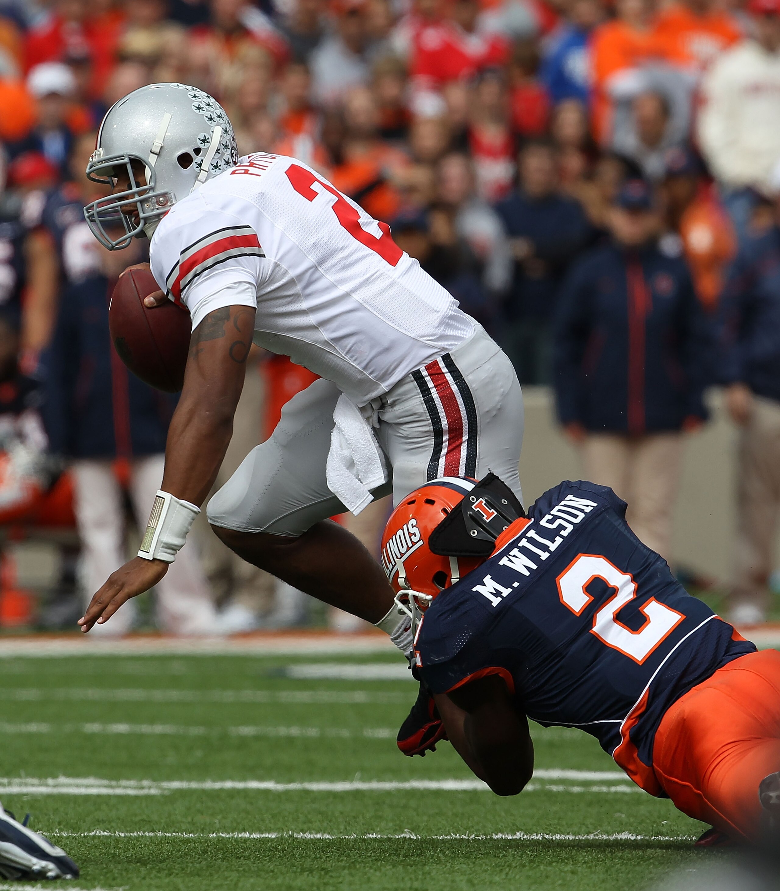 CHAMPAIGN, IL - OCTOBER 02: Terrelle Pryor #2 of the Ohio State Buckeyes is brought down by Martez Wilson #2 of the Illinois Fighting Illini at Memorial Stadium on October 2, 2010 in Champaign, Illinois. Ohio State defeated Illinois 24-13. (Photo by Jonat CHAMPAIGN, IL - OCTOBER 02: Terrelle Pryor #2 of the Ohio State Buckeyes is brought down by Martez Wilson #2 of the Illinois Fighting Illini at Memorial Stadium on October 2, 2010 in Champaign, Illinois. Ohio State defeated Illinois 24-13. (Photo by Jonat