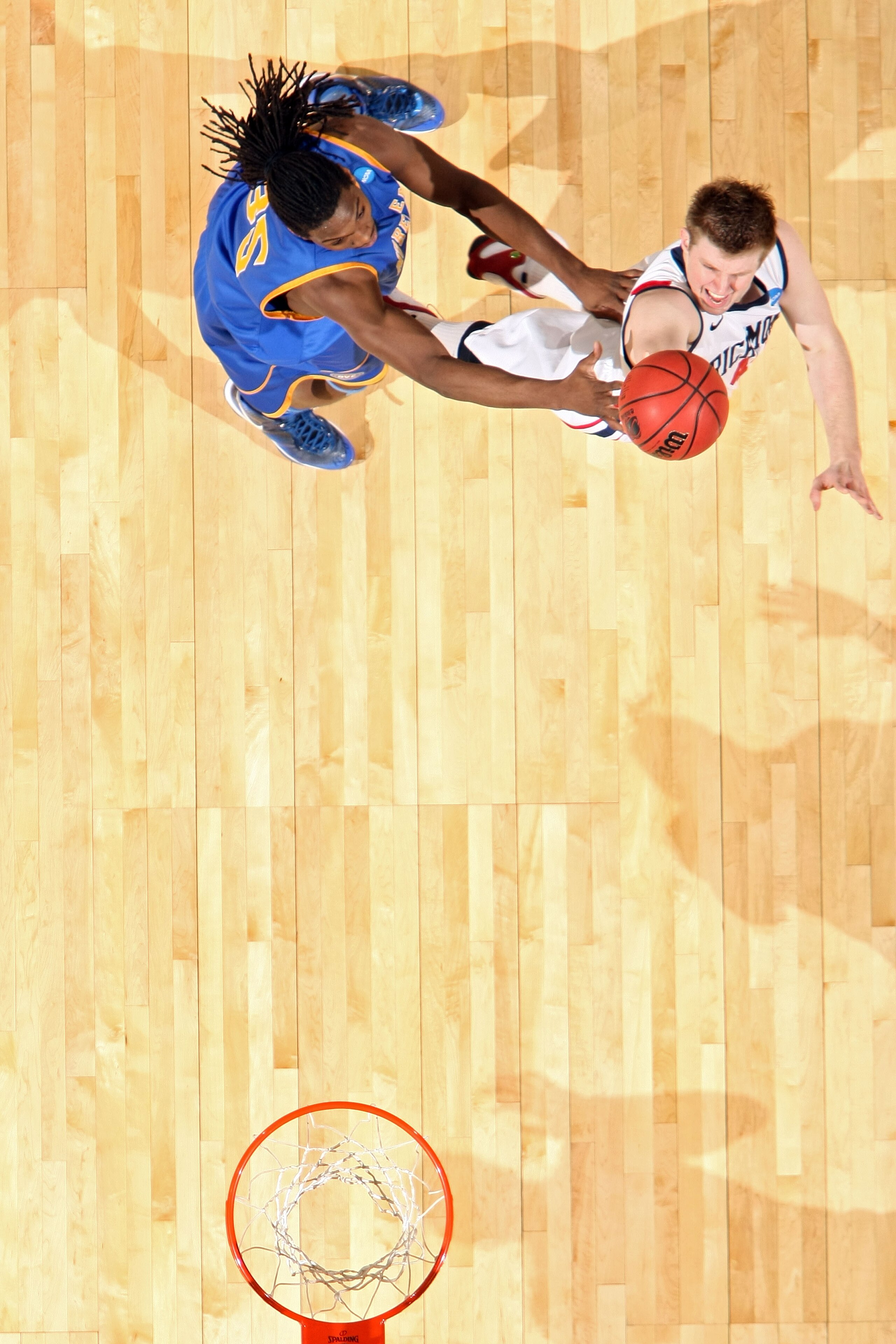 DENVER, CO - MARCH 19: Dan Geriot #41 of the Richmond Spiders shoots the ball against Kenneth Faried #35 of the Morehead State Eagles during the third round of the 2011 NCAA men's basketball tournament at Pepsi Center on March 19, 2011 in Denver, Colorad DENVER, CO - MARCH 19: Dan Geriot #41 of the Richmond Spiders shoots the ball against Kenneth Faried #35 of the Morehead State Eagles during the third round of the 2011 NCAA men's basketball tournament at Pepsi Center on March 19, 2011 in Denver, Colorad