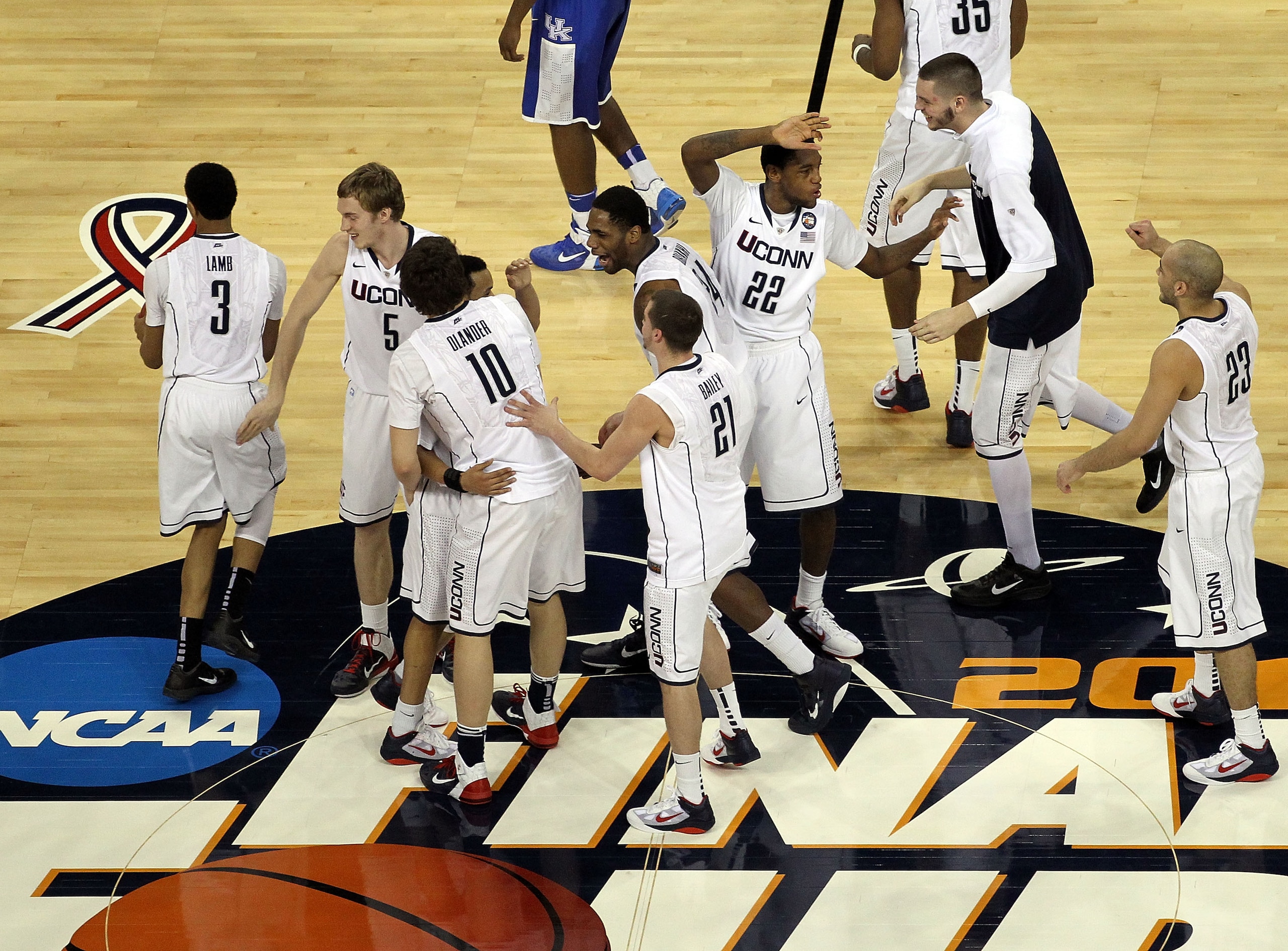HOUSTON, TX - APRIL 02:  The Connecticut Huskies celebrate after defeating the Kentucky Wildcats during the National Semifinal game of the 2011 NCAA Division I Men's Basketball Championship at Reliant Stadium on April 2, 2011 in Houston, Texas.  (Photo by
