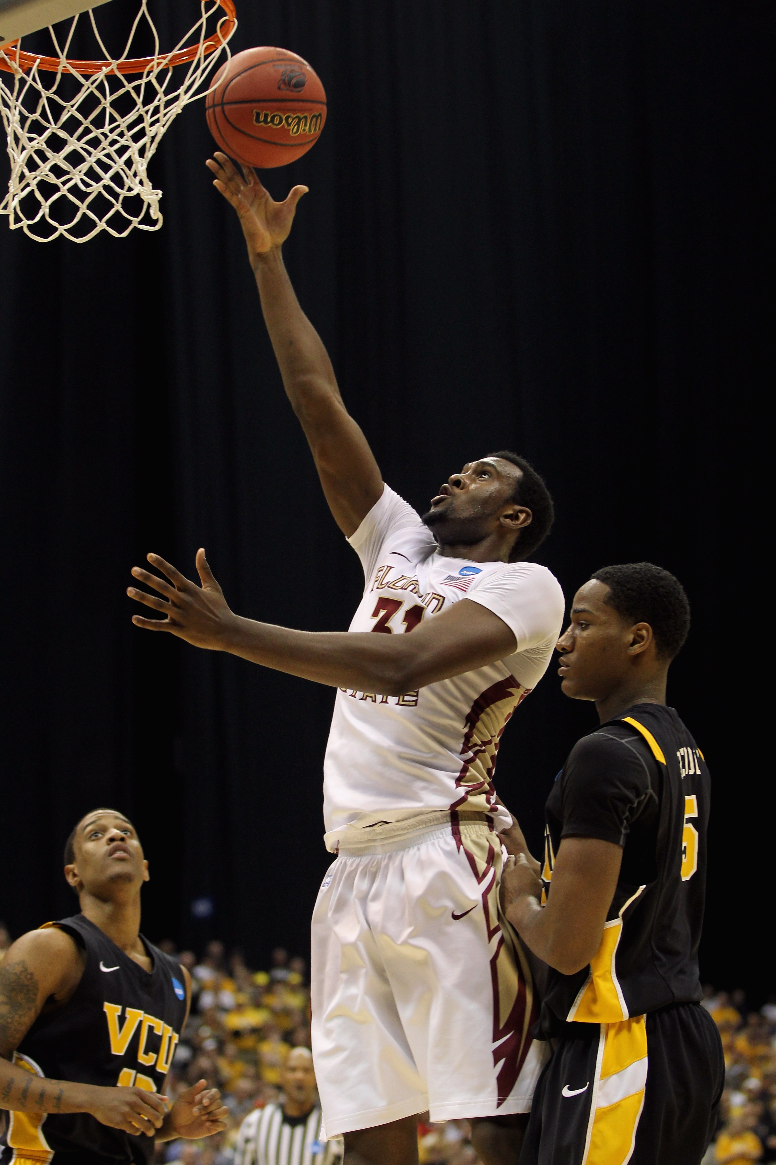 SAN ANTONIO, TX - MARCH 25:  Chris Singleton #31 of the Florida State Seminoles puts up a shot against Juvonte Reddic #5 of the Virginia Commonwealth Rams during the southwest regional of the 2011 NCAA men's basketball tournament at the Alamodome on March