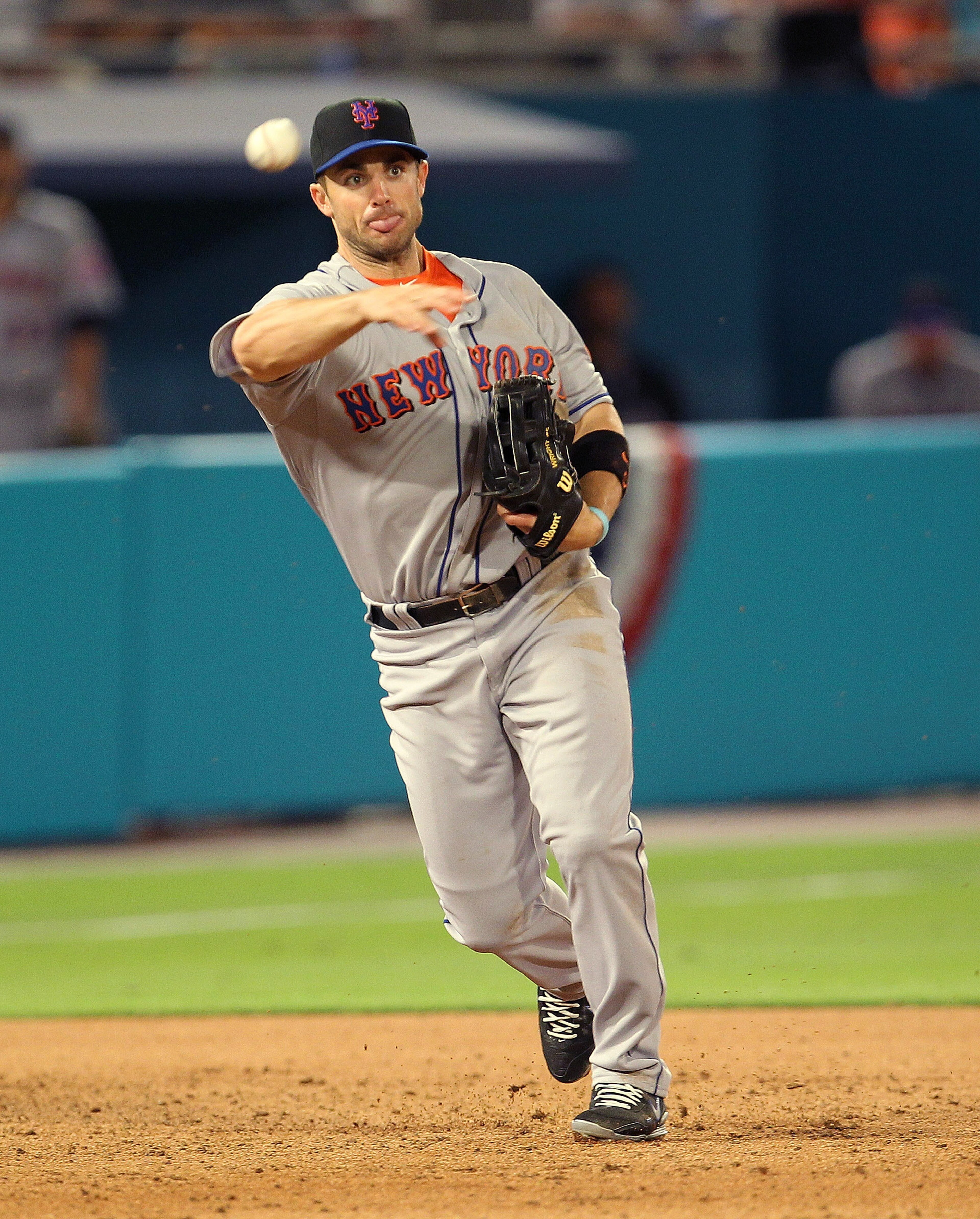 MIAMI GARDENS, FL - APRIL 01:  David Wright #5 of the New York Mets makes a throw to first during opening day against the Florida Marlins at Sun Life Stadium on April 1, 2011 in Miami Gardens, Florida.  (Photo by Mike Ehrmann/Getty Images)