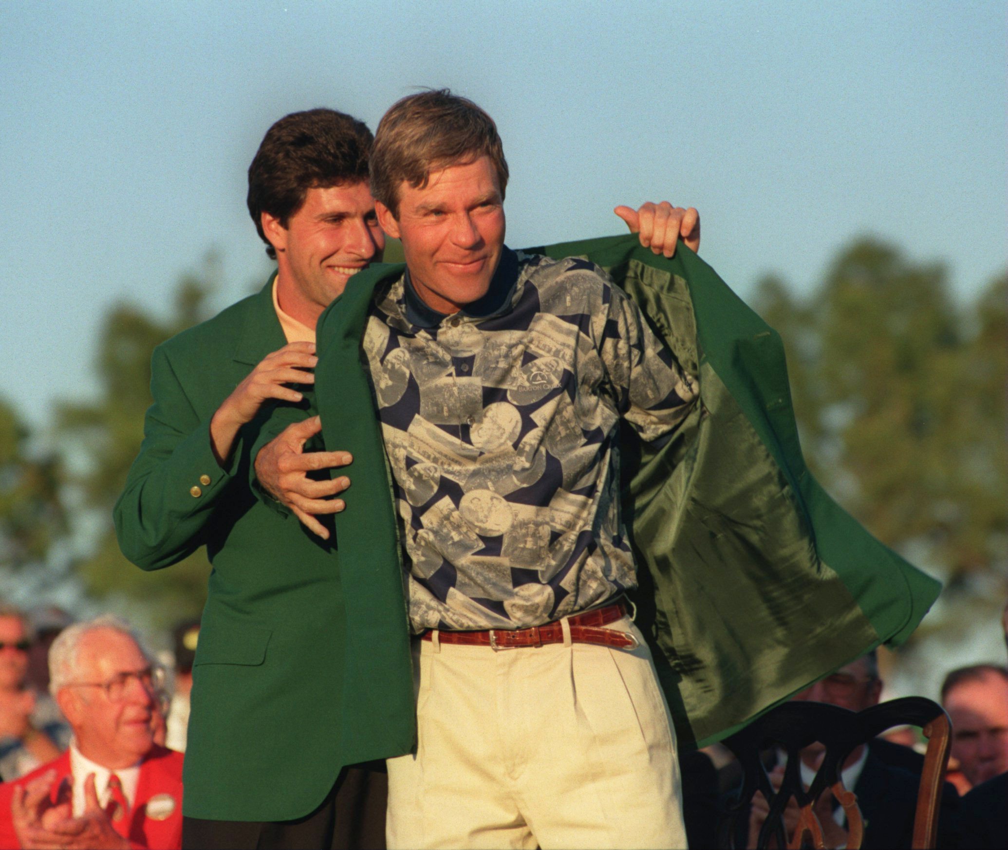 9 APR 1995:  BEN CRENSHAW OF THE USA IS HELPED ON WITH HIS GREEN JACKET BY 1994 WINNER JOSE  MARIA OLAZABAL OF SPAIN  AFTER WINNING THE 1995 US MASTERS GOLF CHAMPIONSHIP AT THE AUGUSTA NATIONAL GOLF COURSE IN AUGUSTA, GEORGIA. Mandatory Credit: Steve Mund