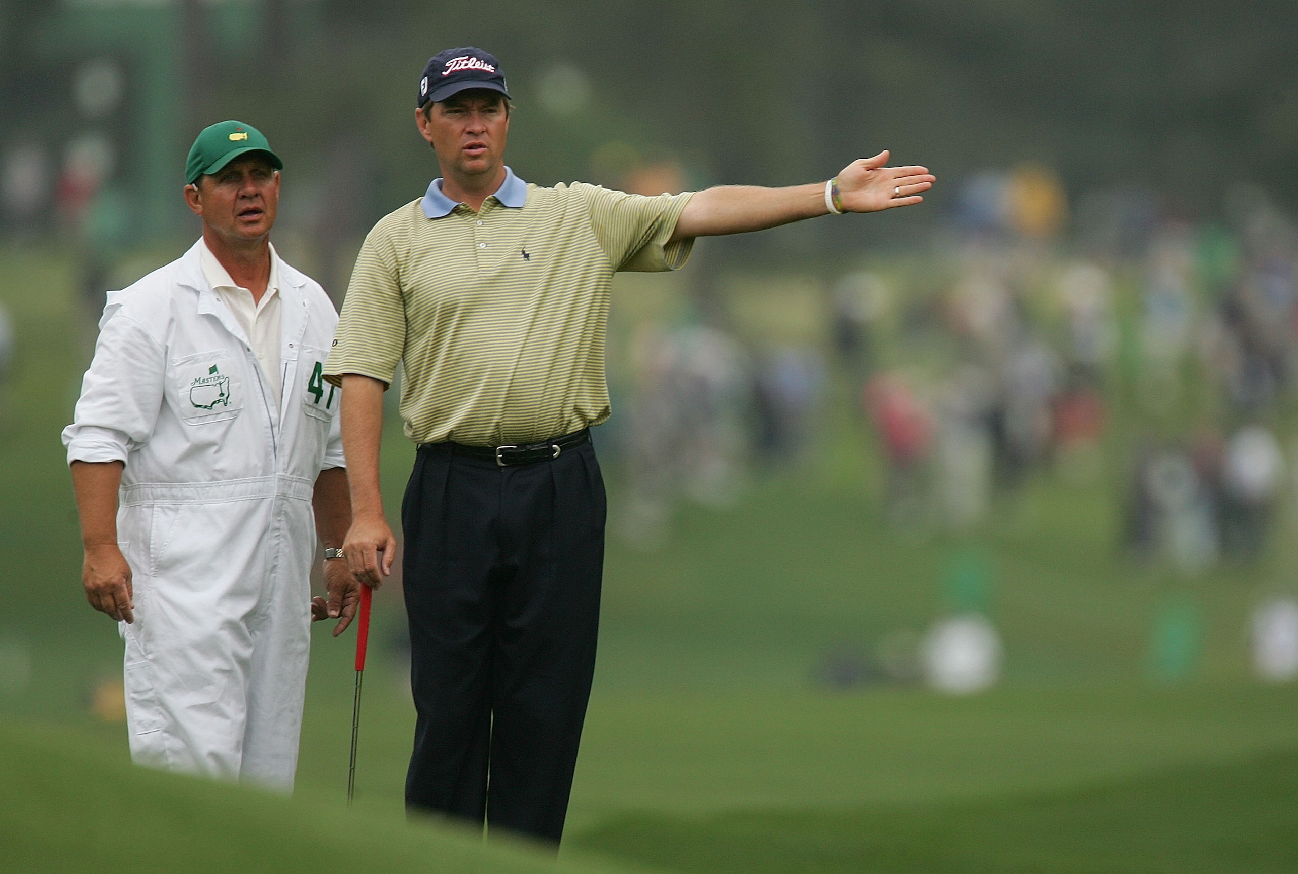 AUGUSTA, GA - APRIL 8: Davis Love III chats with his caddie John Burke on the eighth hole during the first round The Masters at the Augusta National Golf Club on April 8, 2005 in Augusta, Georgia. (Photo by David Cannon/Getty Images)