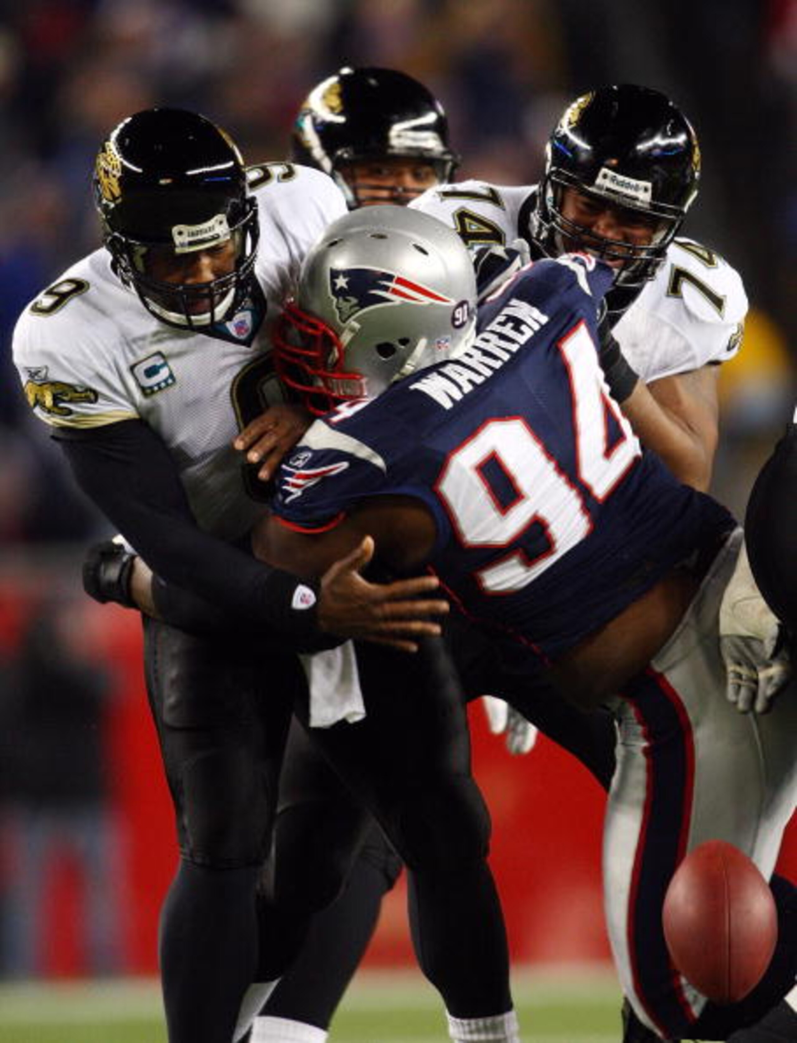 FOXBOROUGH, MA - JANUARY 12: Ty Warren #94 of the New England Patriots causes David Garrard #9 of the Jacksonville Jaguars to fumble during the AFC Divisional playoff game at Gillette Stadium game on January 12, 2008 in Foxboro, Massachusetts. (Photo by FOXBOROUGH, MA - JANUARY 12: Ty Warren #94 of the New England Patriots causes David Garrard #9 of the Jacksonville Jaguars to fumble during the AFC Divisional playoff game at Gillette Stadium game on January 12, 2008 in Foxboro, Massachusetts. (Photo by