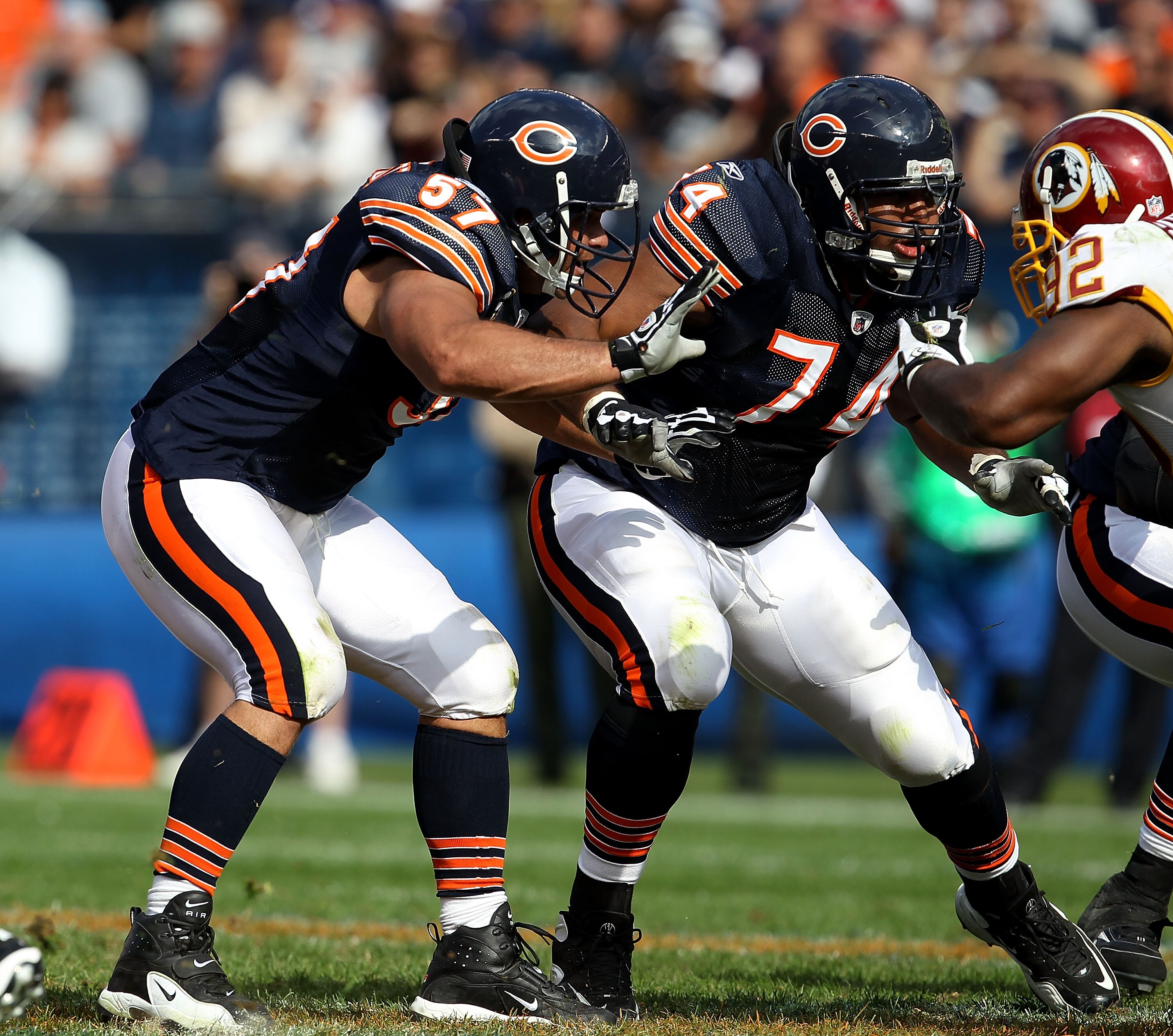 CHICAGO - OCTOBER 24: Olin Kreutz #57 and Chris Williams #74 of the Chicago Bears move to block against the Washington Redskins at Soldier Field on October 24, 2010 in Chicago, Illinois. The Redskins defeated the Bears 17-14. (Photo by Jonathan Daniel/Get