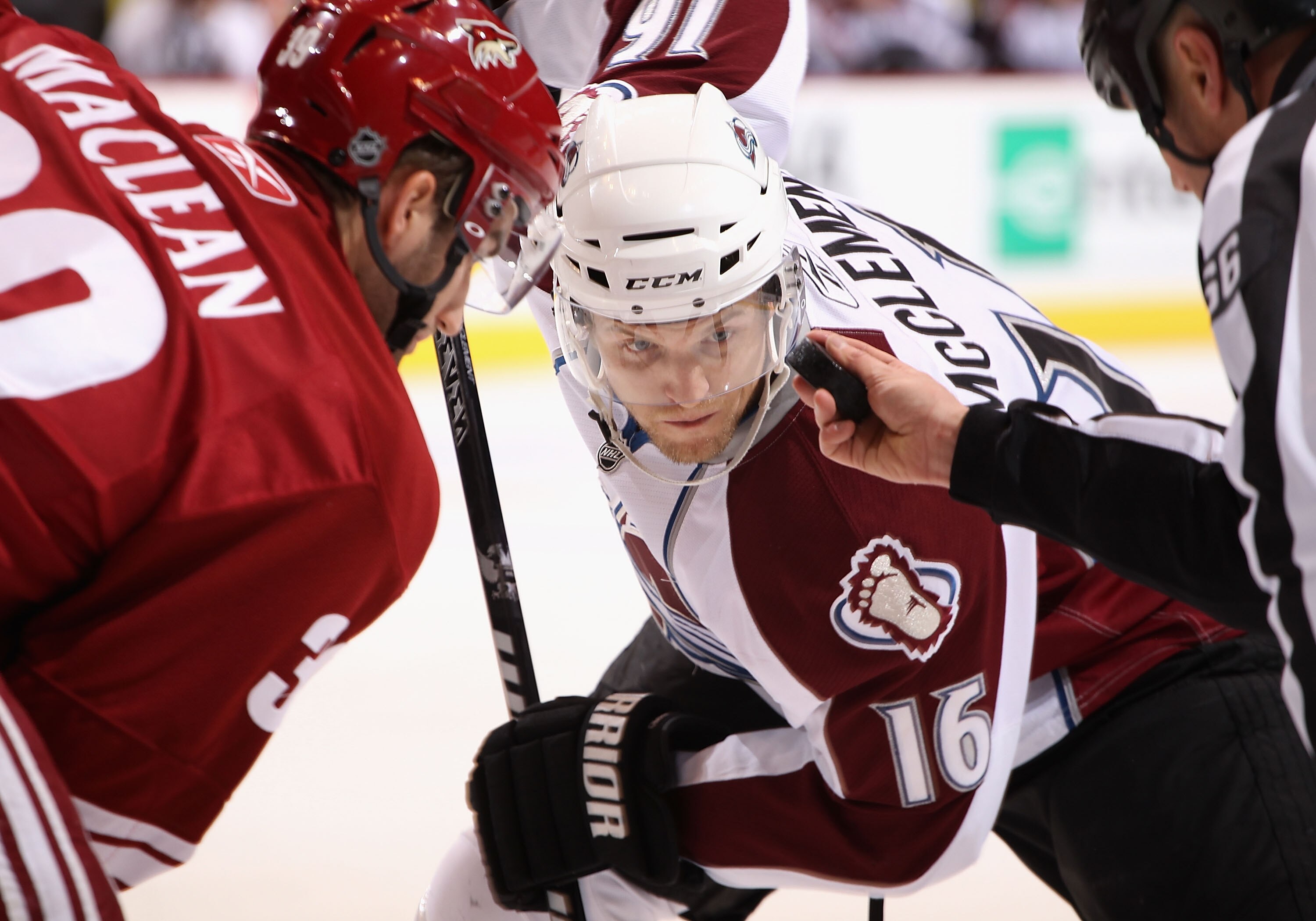GLENDALE, AZ - APRIL 01:  Jay McClement #16 of the Colorado Avalanche faces off against Brett MacLean #39 of the Phoenix Coyotes during the NHL game at Jobing.com Arena on April 1, 2011 in Glendale, Arizona. The Avalanche defeated the Coyotes 4-3 in an ov