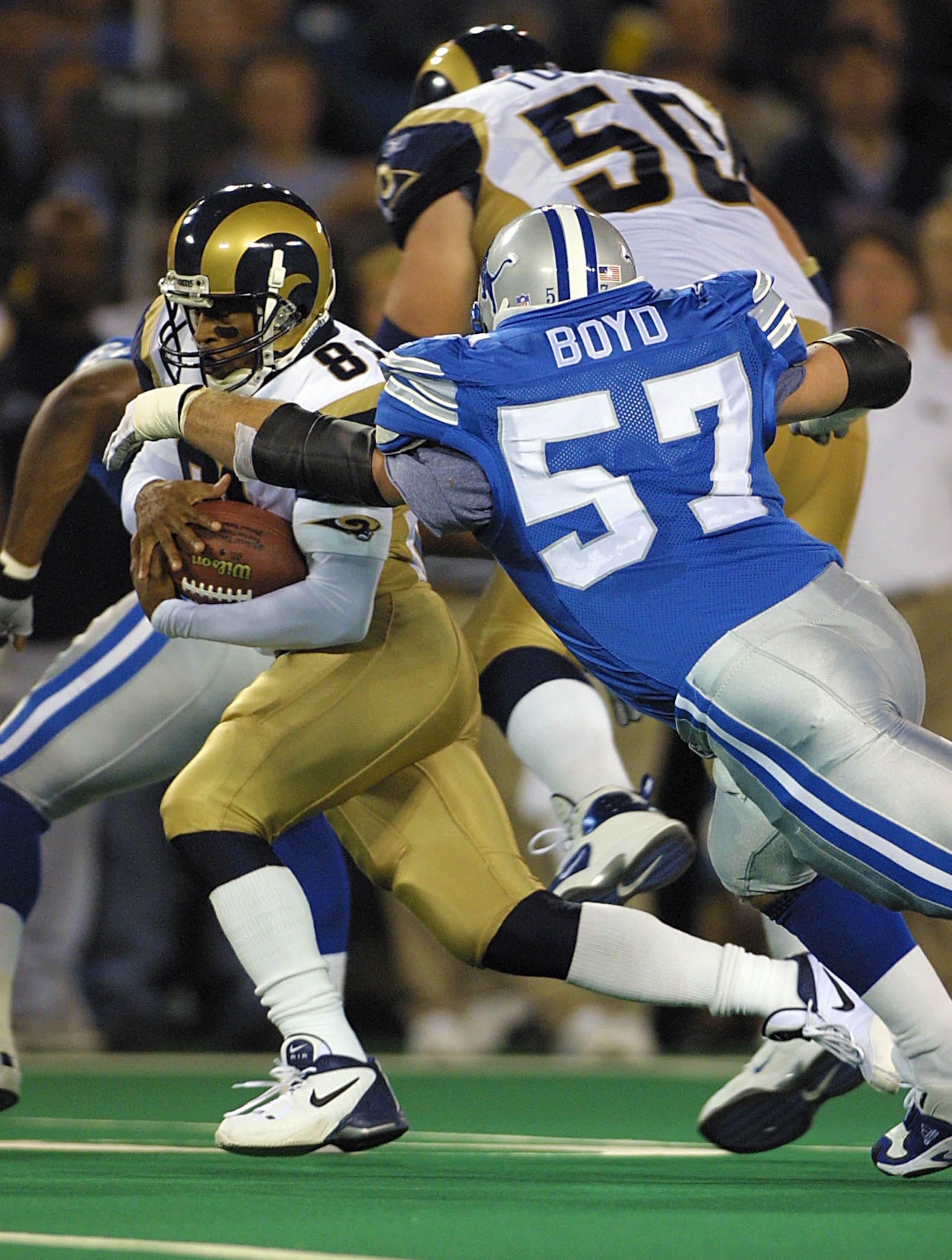 08 Oct 2001: Az-Zahir Hakim #81 of the St.Louis Rams tries to elude Stephen Boyd #57 of the Detroit Lions during the game at the Pontiac Silverdome in Pontiac, Michigan. The Rams defeated the Lions 35-0. DIGITAL IMAGE. Mandatory Credit: Tom Pidgeon/Allsp 08 Oct 2001: Az-Zahir Hakim #81 of the St.Louis Rams tries to elude Stephen Boyd #57 of the Detroit Lions during the game at the Pontiac Silverdome in Pontiac, Michigan. The Rams defeated the Lions 35-0. DIGITAL IMAGE. Mandatory Credit: Tom Pidgeon/Allsp
