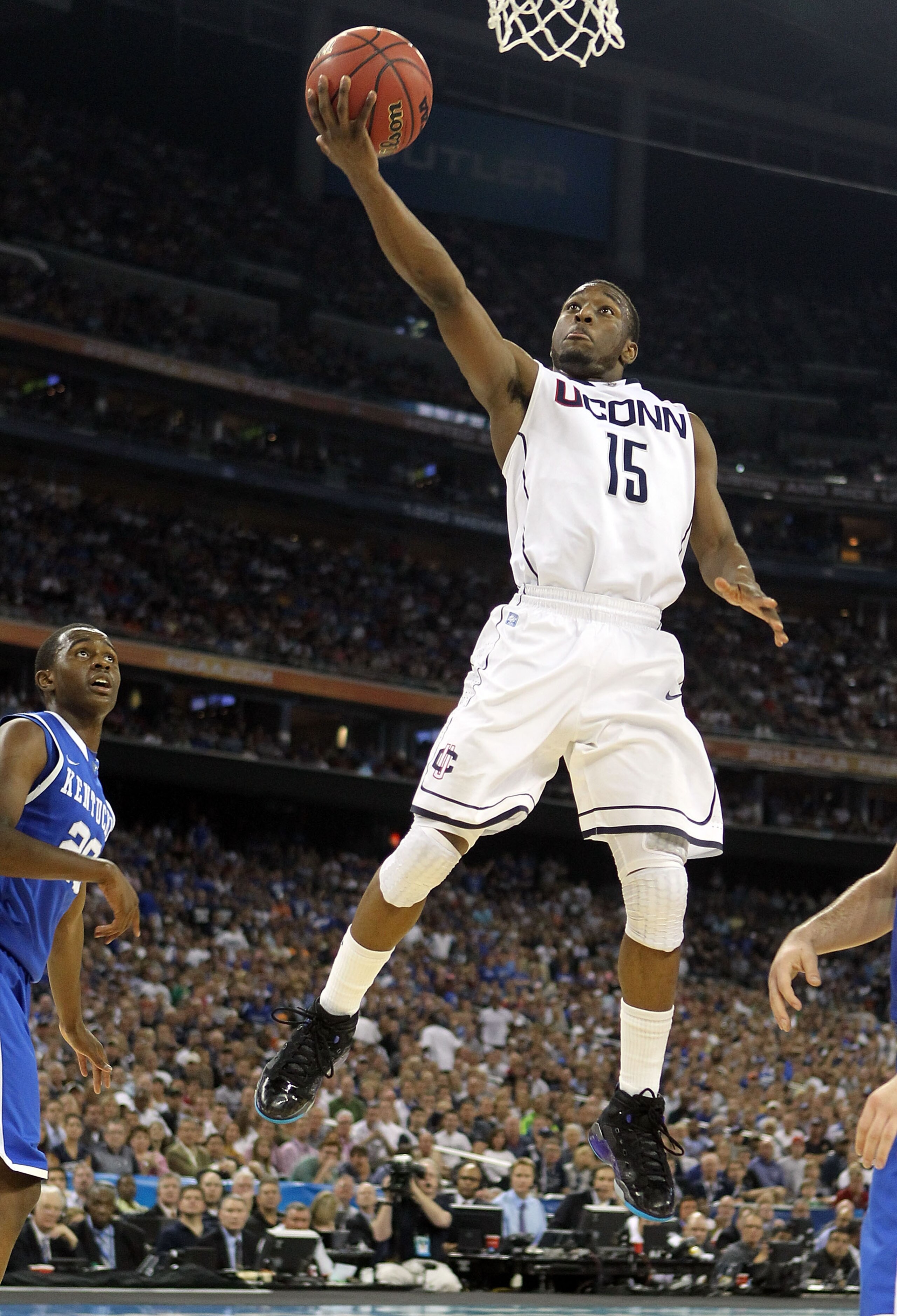 HOUSTON, TX - APRIL 02:  Kemba Walker #15 of the Connecticut Huskies goes to the hoop against the Kentucky Wildcats during the National Semifinal game of the 2011 NCAA Division I Men's Basketball Championship at Reliant Stadium on April 2, 2011 in Houston