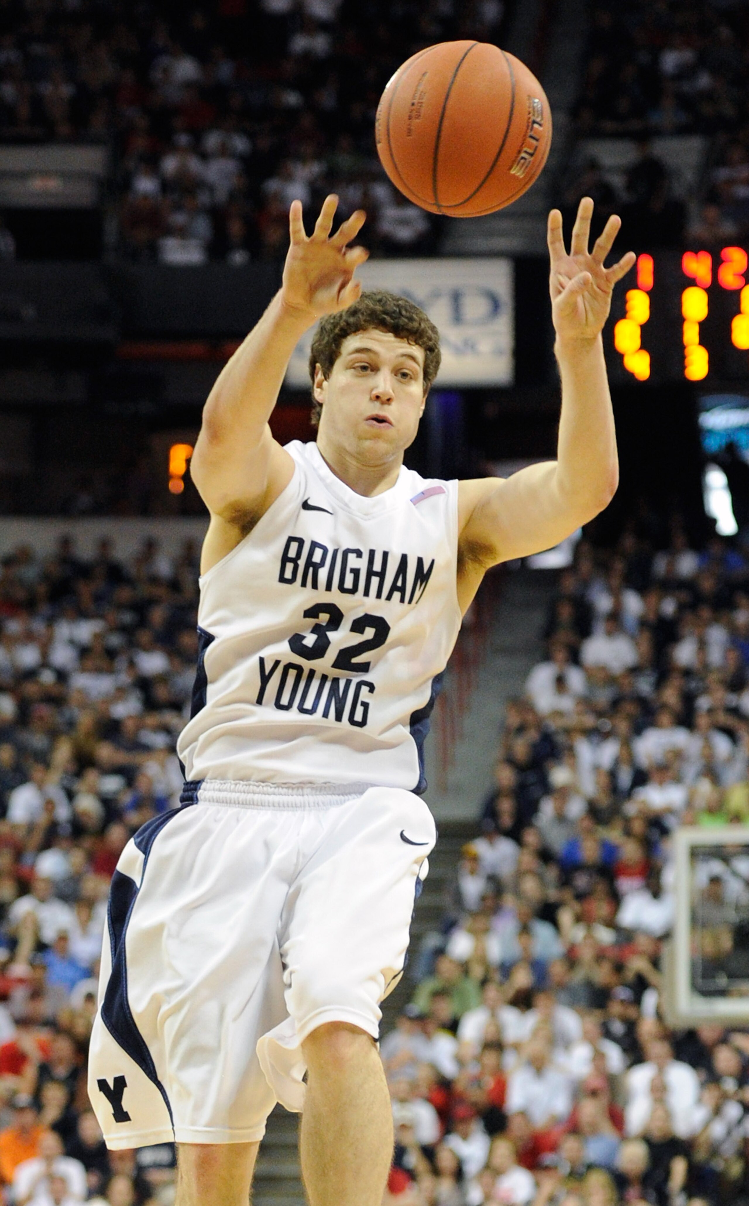 LAS VEGAS, NV - MARCH 12:  Jimmer Fredette #32 of the Brigham Young University Cougars passes the ball during the championship game of the Conoco Mountain West Conference Basketball tournament against the San Diego State Aztecs at the Thomas & Mack Center