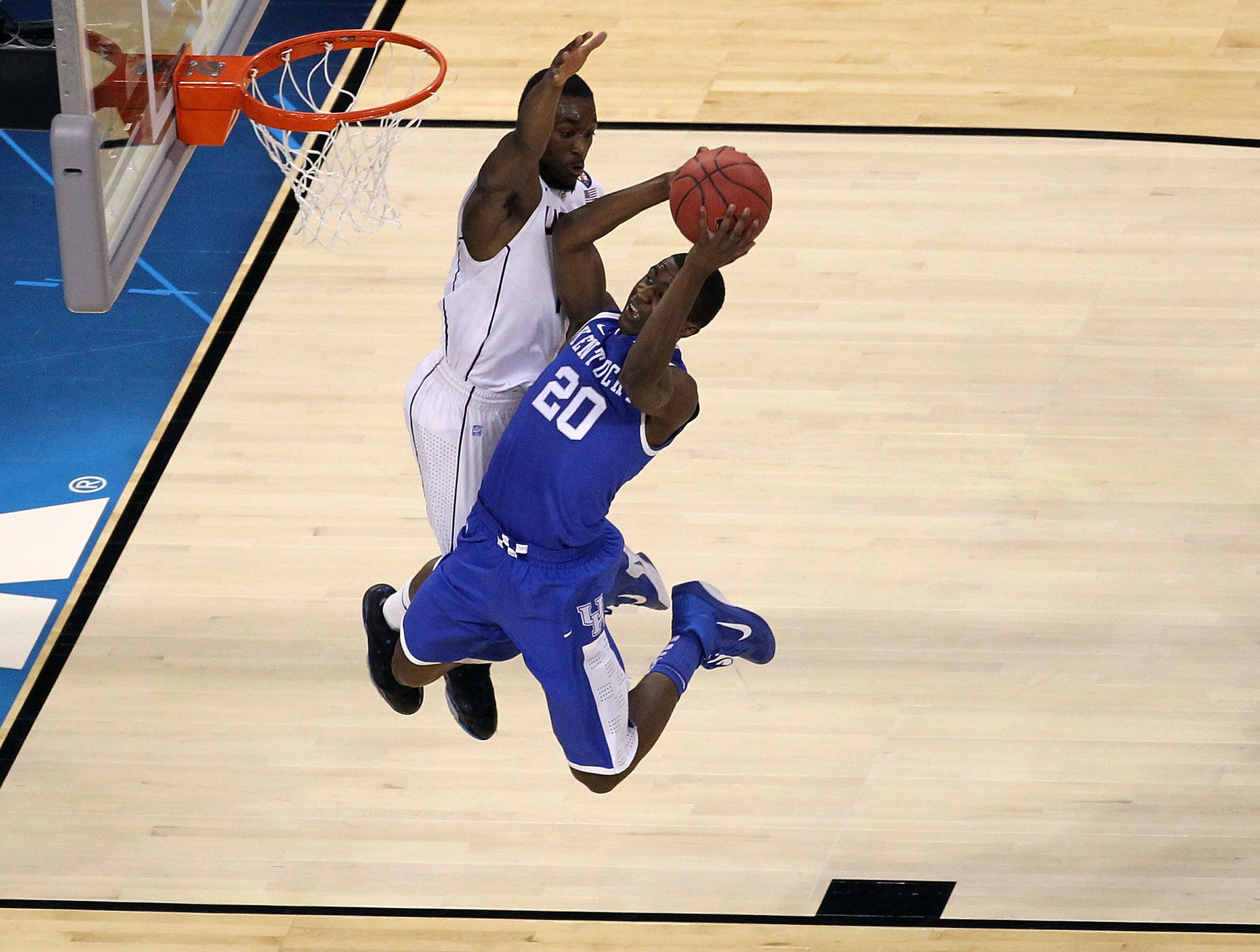 HOUSTON, TX - APRIL 02:  Doron Lamb #20 of the Kentucky Wildcats goes to the hoop against Kemba Walker #15 of the Connecticut Huskies during the National Semifinal game of the 2011 NCAA Division I Men's Basketball Championship at Reliant Stadium on April 