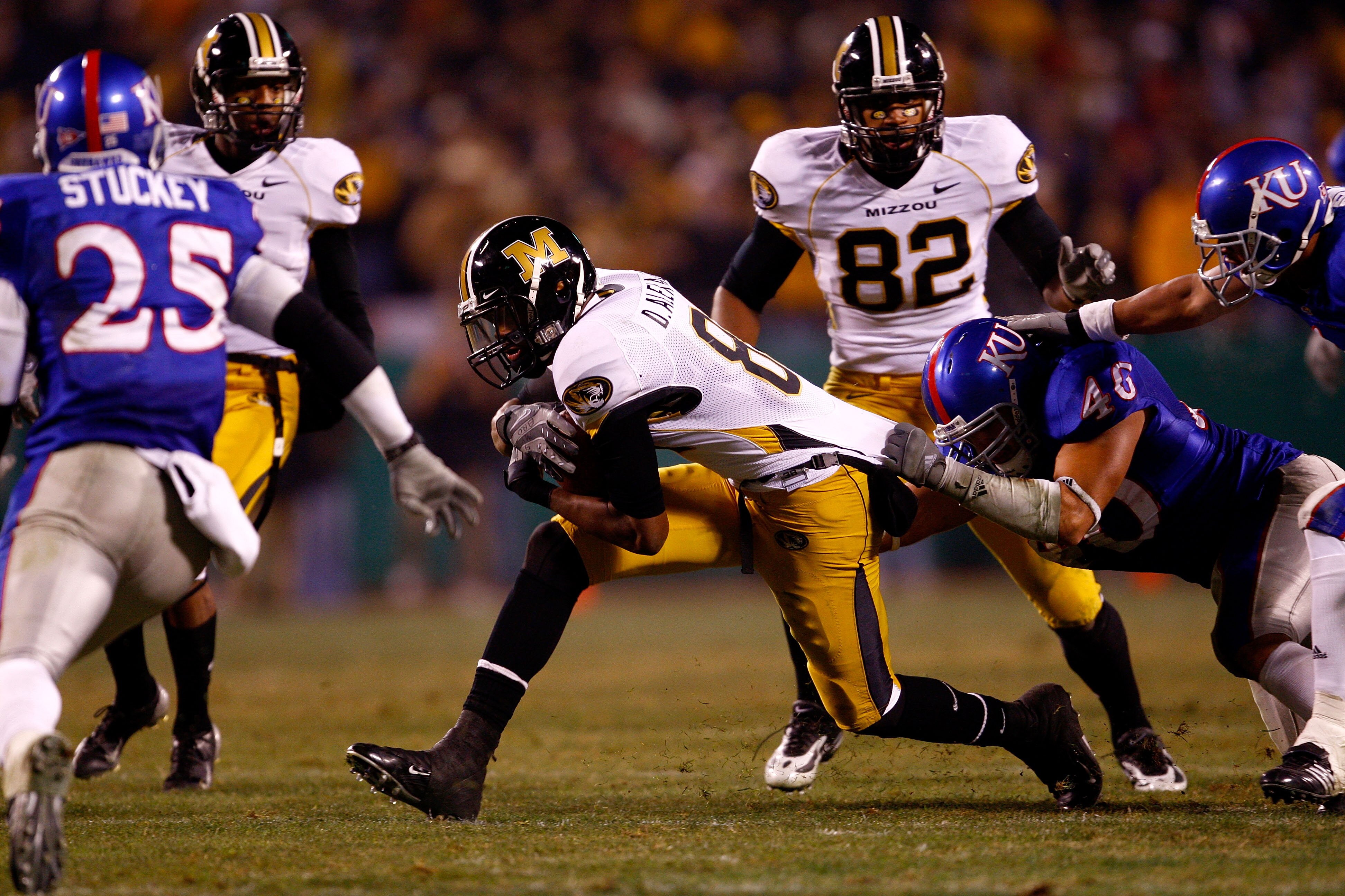 KANSAS CITY, MO - NOVEMBER 24:  Danario Alexander #81 of the Missouri Tigers is brought down by Justin Thornton #46 of the Kansas Jayhawks during the game at Arrowhead Stadium November 24, 2007 in Kansas City, Missouri.  (Photo by Jamie Squire/Getty Image