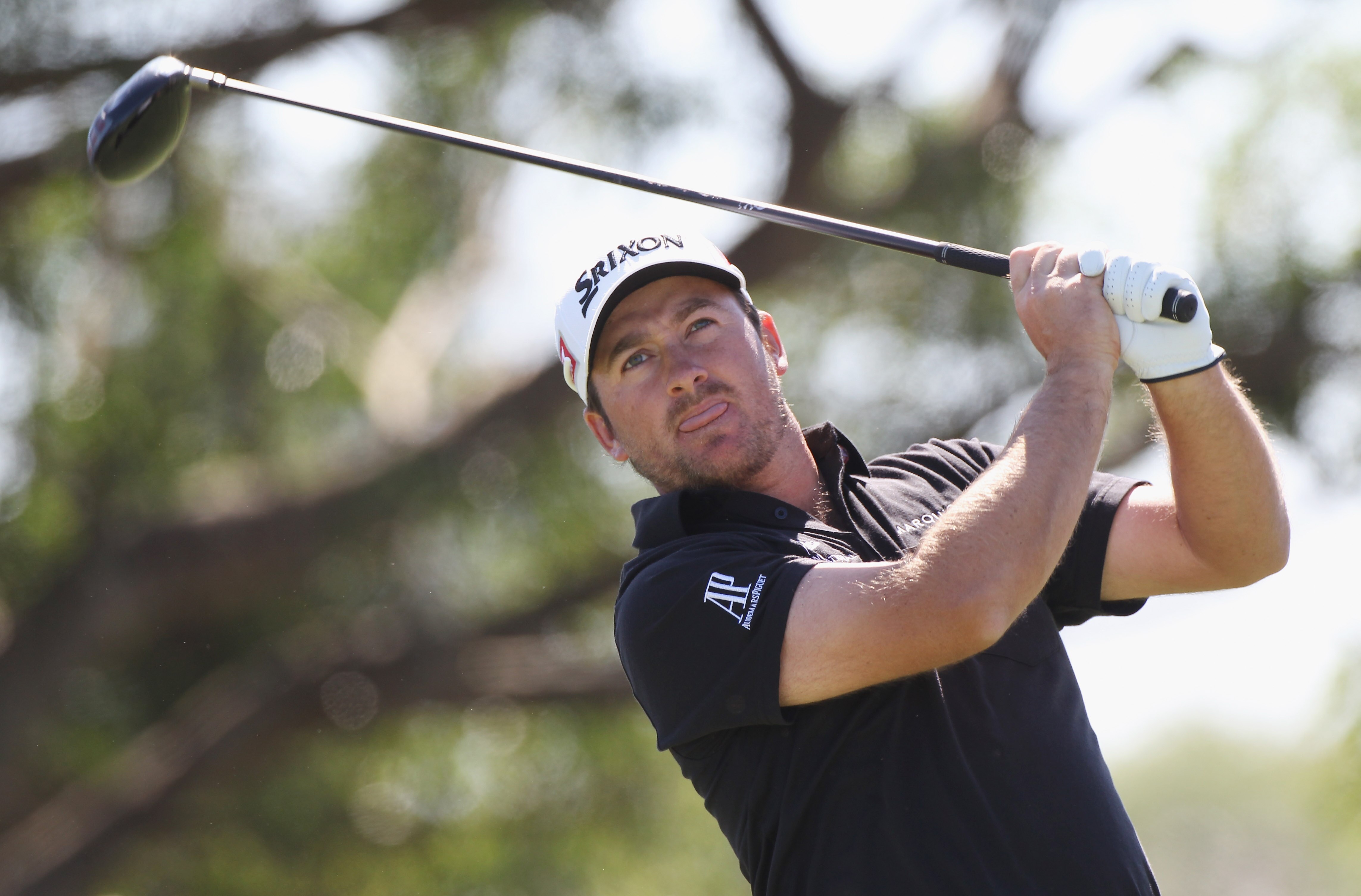 MIAMI, FL - MARCH 11:  Graeme McDowell of Northern Ireland watches his tee shot on the fifth hole during the second round of the 2011 WGC- Cadillac Championship at the TPC Blue Monster at the Doral Golf Resort and Spa on March 11, 2011 in Doral, Florida.