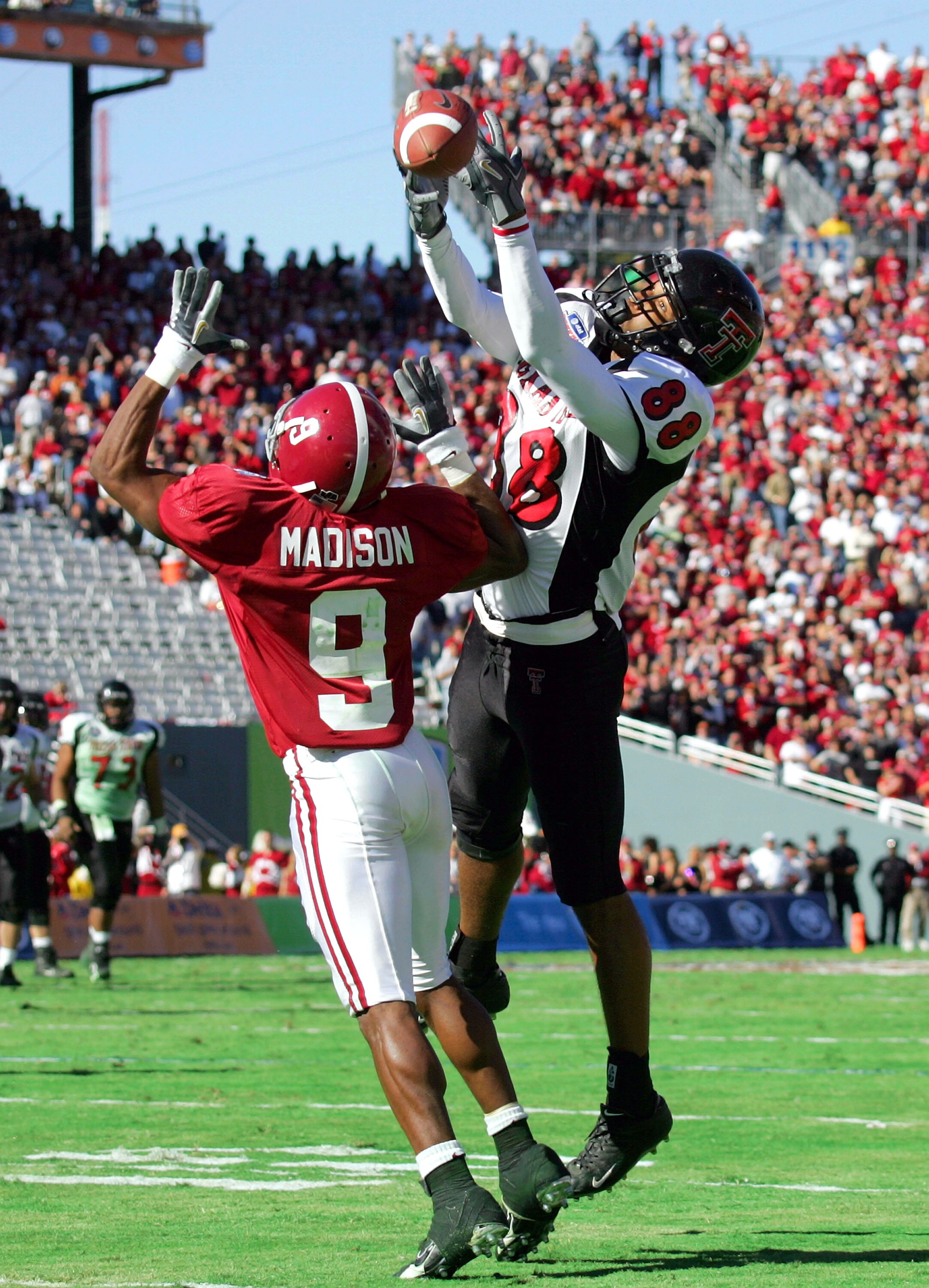 DALLAS - JANUARY 2:  Wide receiver Jarrett Hicks #88 of the Texas Tech Red Raiders drops a pass while defended by Anthony Madison #9 of the Alabama Crimson Tide during the AT&T Cotton Bowl on January 2, 2006 at the Cotton Bowl in Dallas, Texas. The Crimso