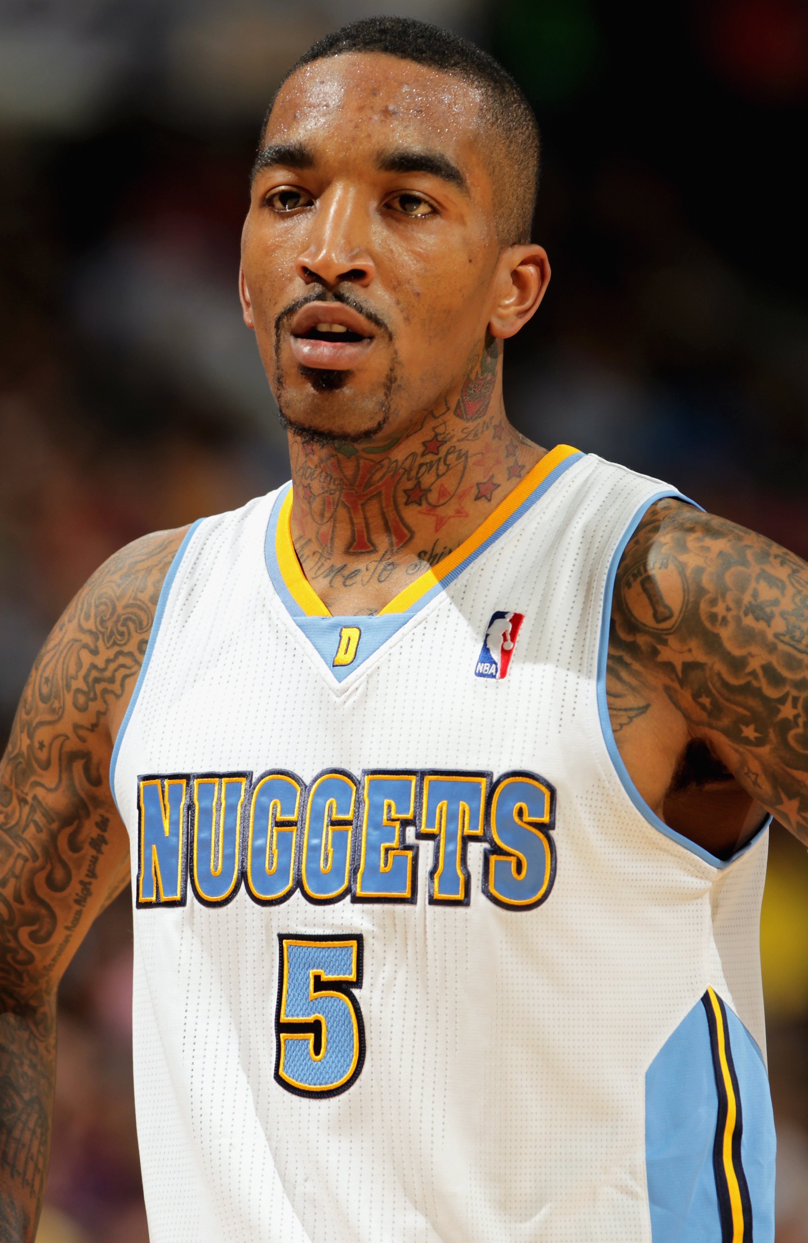 DENVER, CO - MARCH 21:  J.R. Smith #5 of the Denver Nuggets looks on during a break in the action against the Toronto Raptors at the Pepsi Center on March 21, 2011 in Denver, Colorado. The Nuggets defeated the Raptors 123-90. NOTE TO USER: User expressly