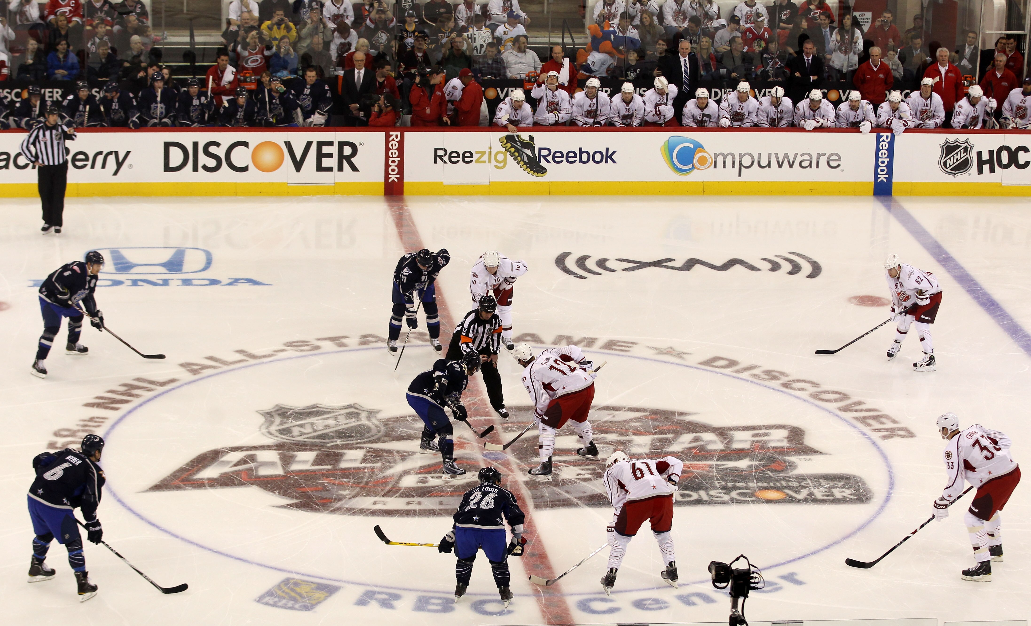 RALEIGH, NC - JANUARY 30:  Brad Richards #91 of the Dallas Stars for Team Lidstrom and Eric Staal #12 of the Carolina Hurricanes for Team Staal go after the opening face-off in the 58th NHL All-Star Game at RBC Center on January 30, 2011 in Raleigh, North