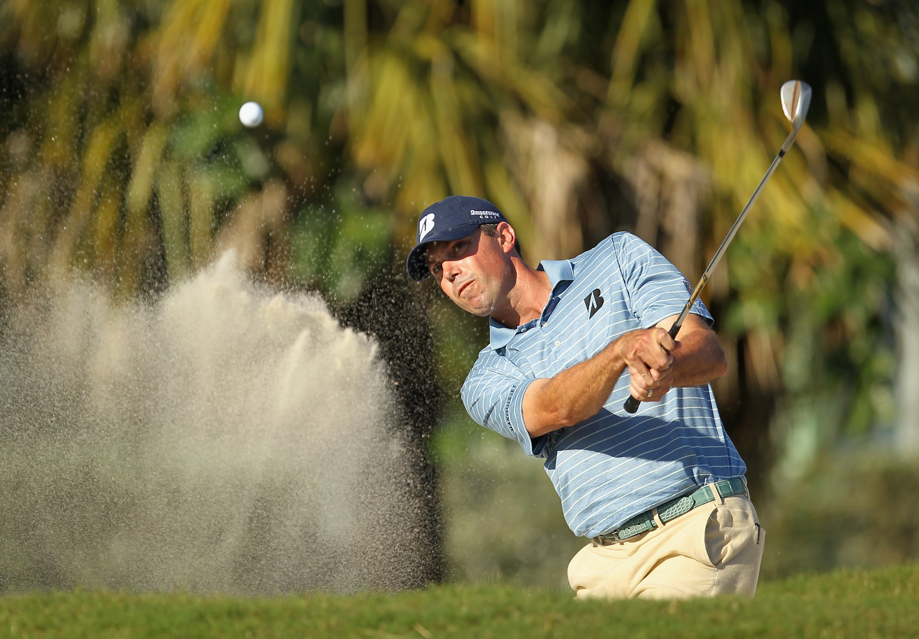 DORAL, FL - MARCH 13:  Matt Kuchar hits a bunker shot on the 13th hole during the final round of the 2011 WGC- Cadillac Championship at the TPC Blue Monster at the Doral Golf Resort and Spa on March 13, 2011 in Doral, Florida.  (Photo by Mike Ehrmann/Gett