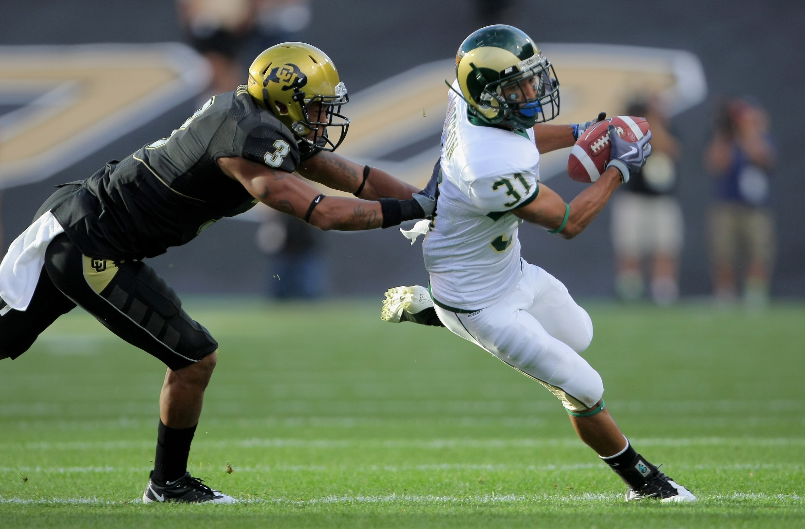 BOULDER, CO - SEPTEMBER 06: Wide receiver Dion Morton #31 of the Colorado State Ramsmakes a reception as cornerback Jimmy Smith #3 of the Colorado Buffaloes defends at Folsom Field on September 6, 2009 in Boulder, Colorado. The Rams defeated the Buffaloe BOULDER, CO - SEPTEMBER 06: Wide receiver Dion Morton #31 of the Colorado State Ramsmakes a reception as cornerback Jimmy Smith #3 of the Colorado Buffaloes defends at Folsom Field on September 6, 2009 in Boulder, Colorado. The Rams defeated the Buffaloe