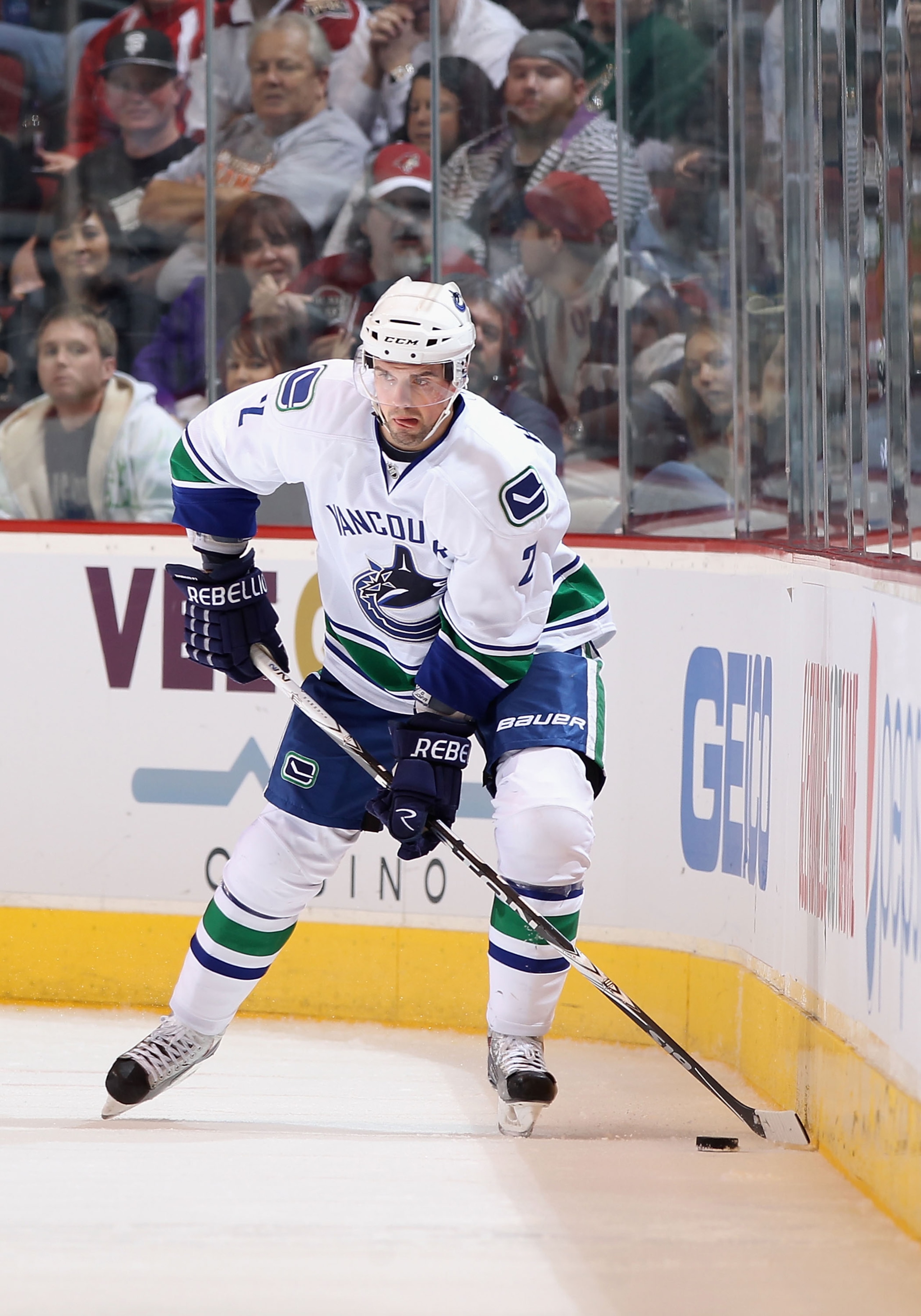 GLENDALE, AZ - MARCH 08:  Dan Hamhuis #2 of the Vancouver Canucks skates with the puck during the NHL game against the Phoenix Coyotes at Jobing.com Arena on March 8, 2011 in Glendale, Arizona. The Canucks defeated the Coyotes 4-3 in overtime.  (Photo by
