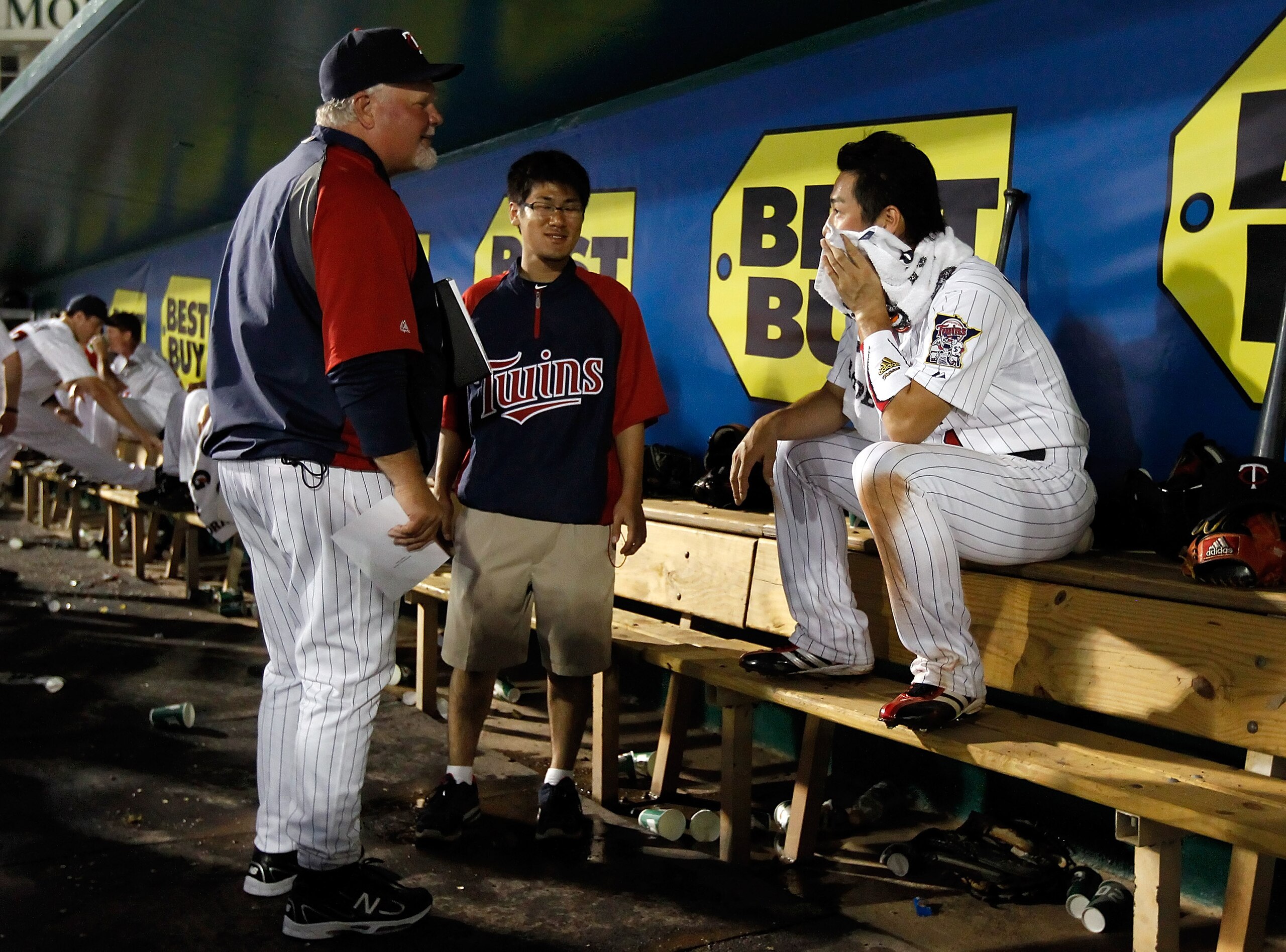 FORT MYERS, FL - FEBRUARY 27:  Manager Ron Gardenhire #35 talks with infielder Tsuyoshi Nishioka #1 of the Minnesota Twins after making a great play against the Boston Red Sox during a Grapefruit League Spring Training Game at Hammond Stadium on February