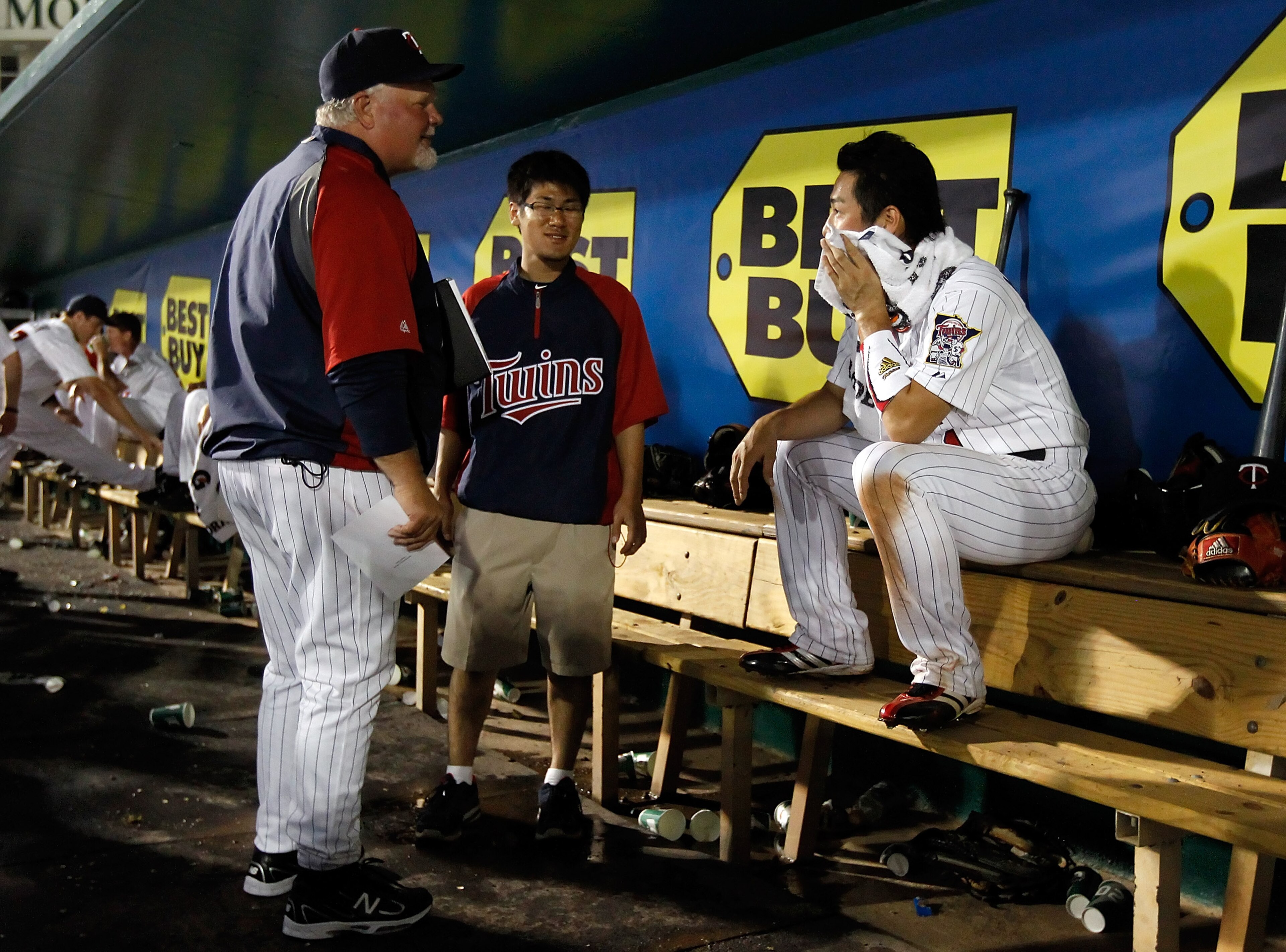 FORT MYERS, FL - FEBRUARY 27:  Manager Ron Gardenhire #35 talks with infielder Tsuyoshi Nishioka #1 of the Minnesota Twins after making a great play against the Boston Red Sox during a Grapefruit League Spring Training Game at Hammond Stadium on February