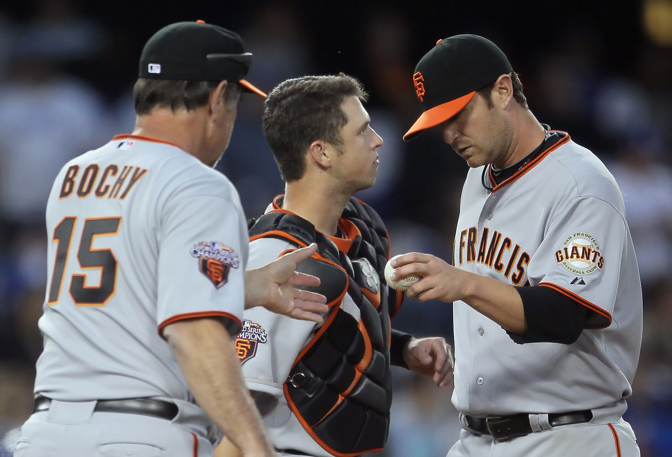 LOS ANGELES, CA - APRIL 03:  Relief pitcher Dan Runzler (R) #45 of the San Francisco Giants hands the ball off to manager Bruce Bochy in the seventh inning against the Los Angeles Dodgers at Dodger Stadium on April 3, 2011 in Los Angeles, California. The