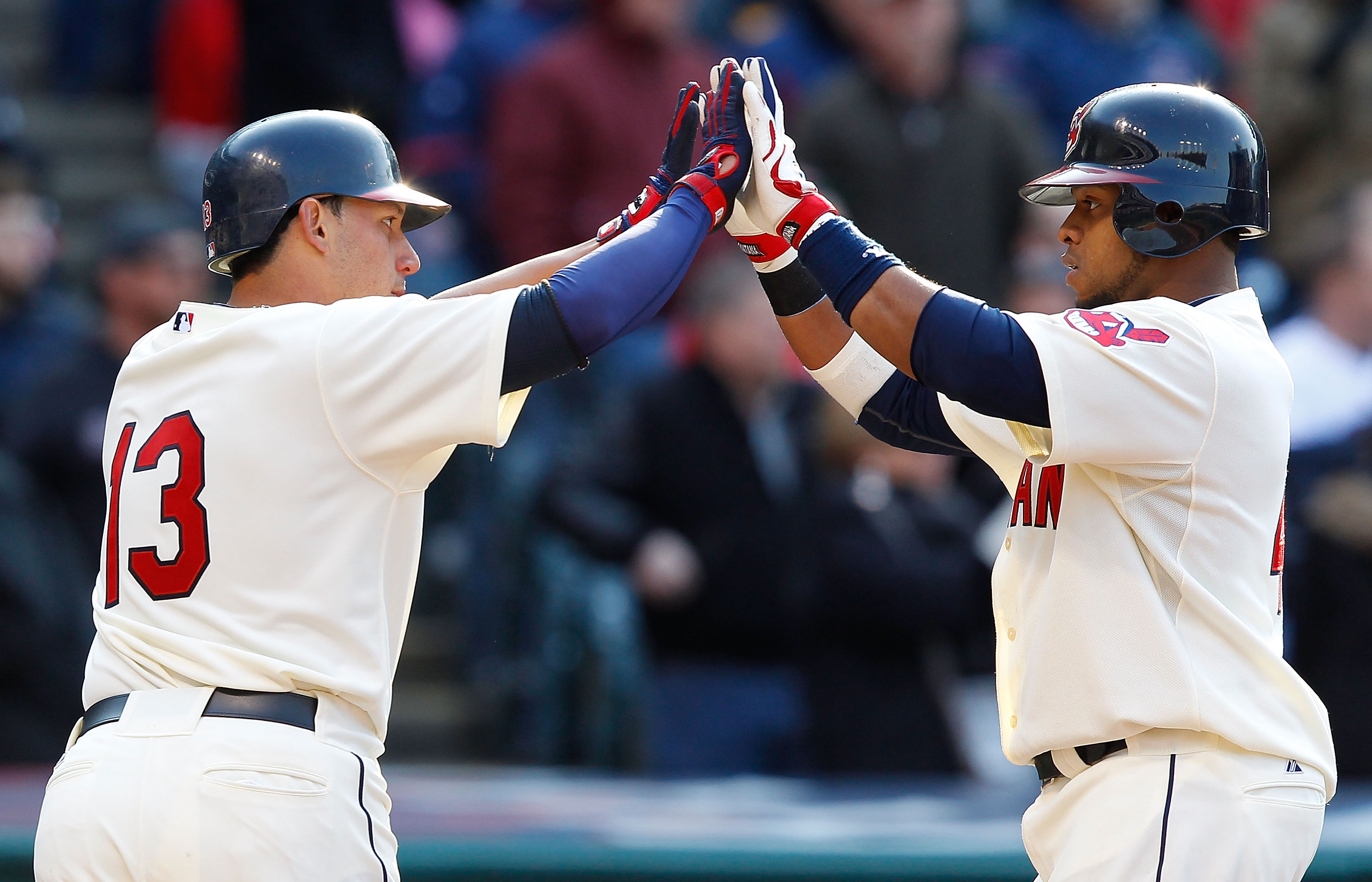 CLEVELAND - APRIL 01: Carlos Santana #41 and Asdrubal Cabrera #13 of the Cleveland Indians celebrate after scoring against the Chicago White Sox during the Opening Day game on April 1, 2011 at Progressive Field in Cleveland, Ohio. (Photo by Jared Wicker CLEVELAND - APRIL 01: Carlos Santana #41 and Asdrubal Cabrera #13 of the Cleveland Indians celebrate after scoring against the Chicago White Sox during the Opening Day game on April 1, 2011 at Progressive Field in Cleveland, Ohio. (Photo by Jared Wicker