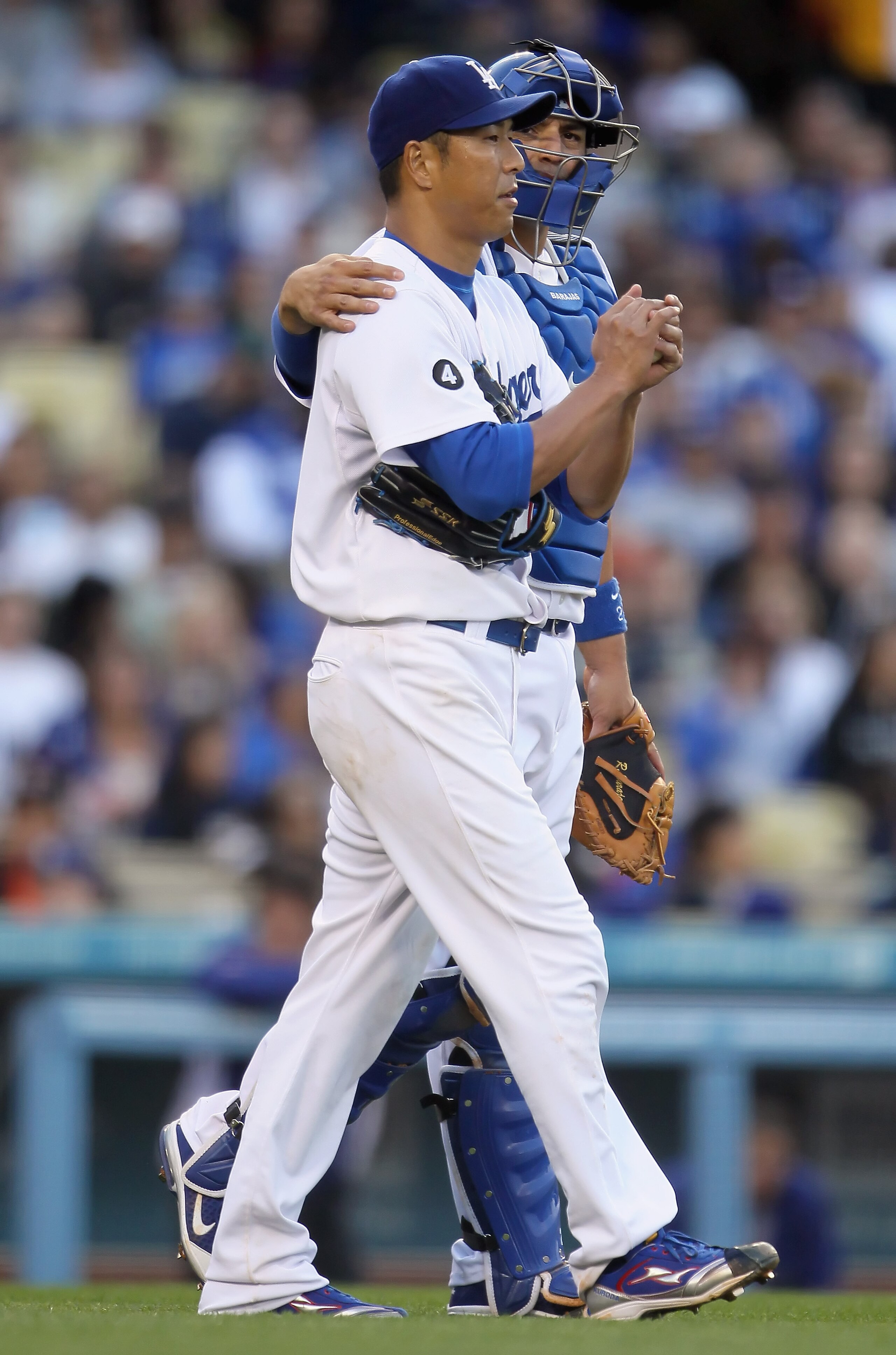 LOS ANGELES, CA - APRIL 03:  Hiroki Kuroda #18 of the Los Angeles Dodgers talks with catcher Rod Barajas #28 in the sixth inning against the San Francisco Giants at Dodger Stadium on April 3, 2011 in Los Angeles, California. The Dodgers defeated the Giant