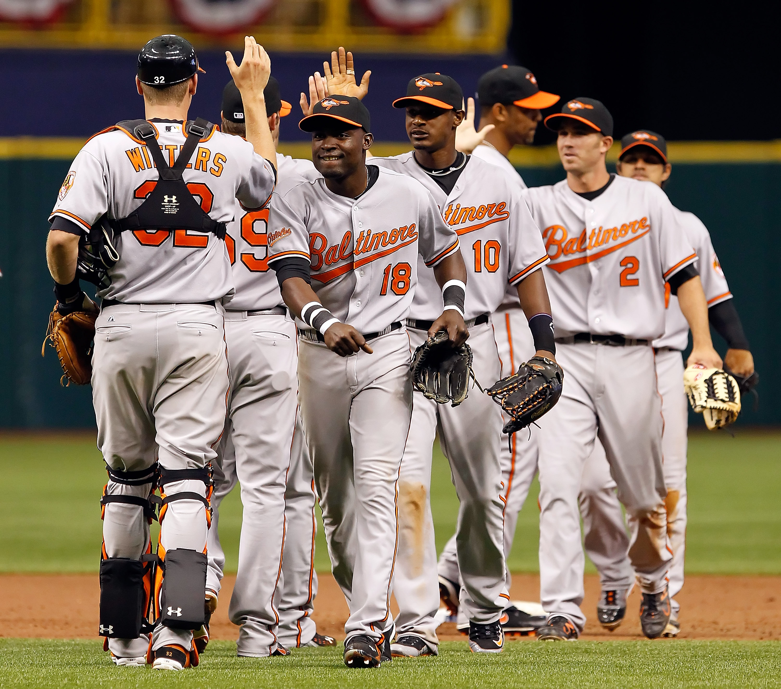 ST. PETERSBURG, FL - APRIL 03: Outfielders Felix Pie #18 and Adam Jones #10 of the Baltimore Orioles celebrate their team's victory over the Tampa Bay Rays at Tropicana Field on April 3, 2011 in St. Petersburg, Florida. (Photo by J. Meric/Getty Images) ST. PETERSBURG, FL - APRIL 03: Outfielders Felix Pie #18 and Adam Jones #10 of the Baltimore Orioles celebrate their team's victory over the Tampa Bay Rays at Tropicana Field on April 3, 2011 in St. Petersburg, Florida. (Photo by J. Meric/Getty Images)