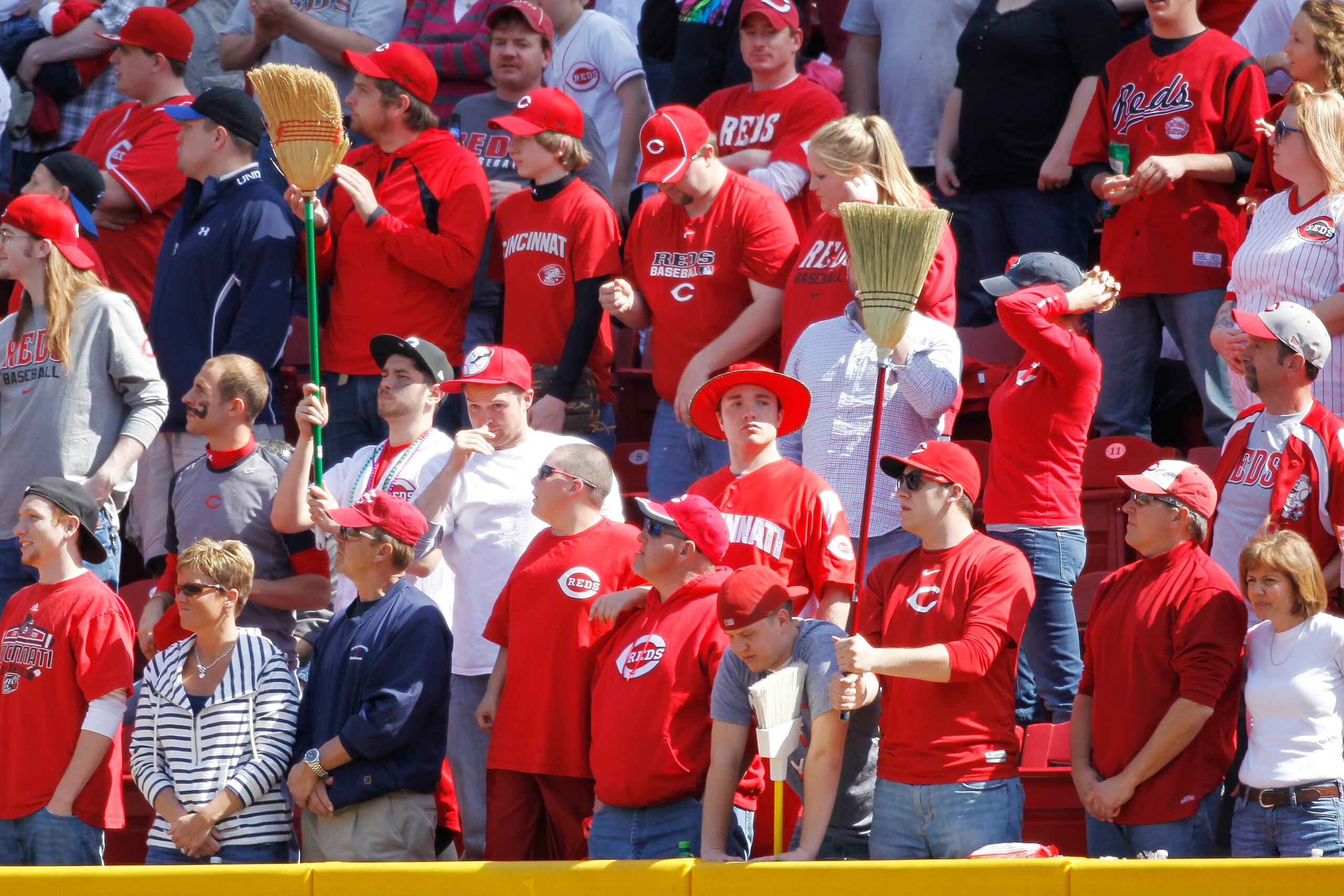 CINCINNATI, OH - APRIL 3: Cincinnati Reds fans hold up brooms late in the game against the Milwaukee Brewers at Great American Ball Park on April 3, 2011 in Cincinnati, Ohio. The Reds won 12-3 to finish off a three-game sweep. (Photo by Joe Robbins/Getty
