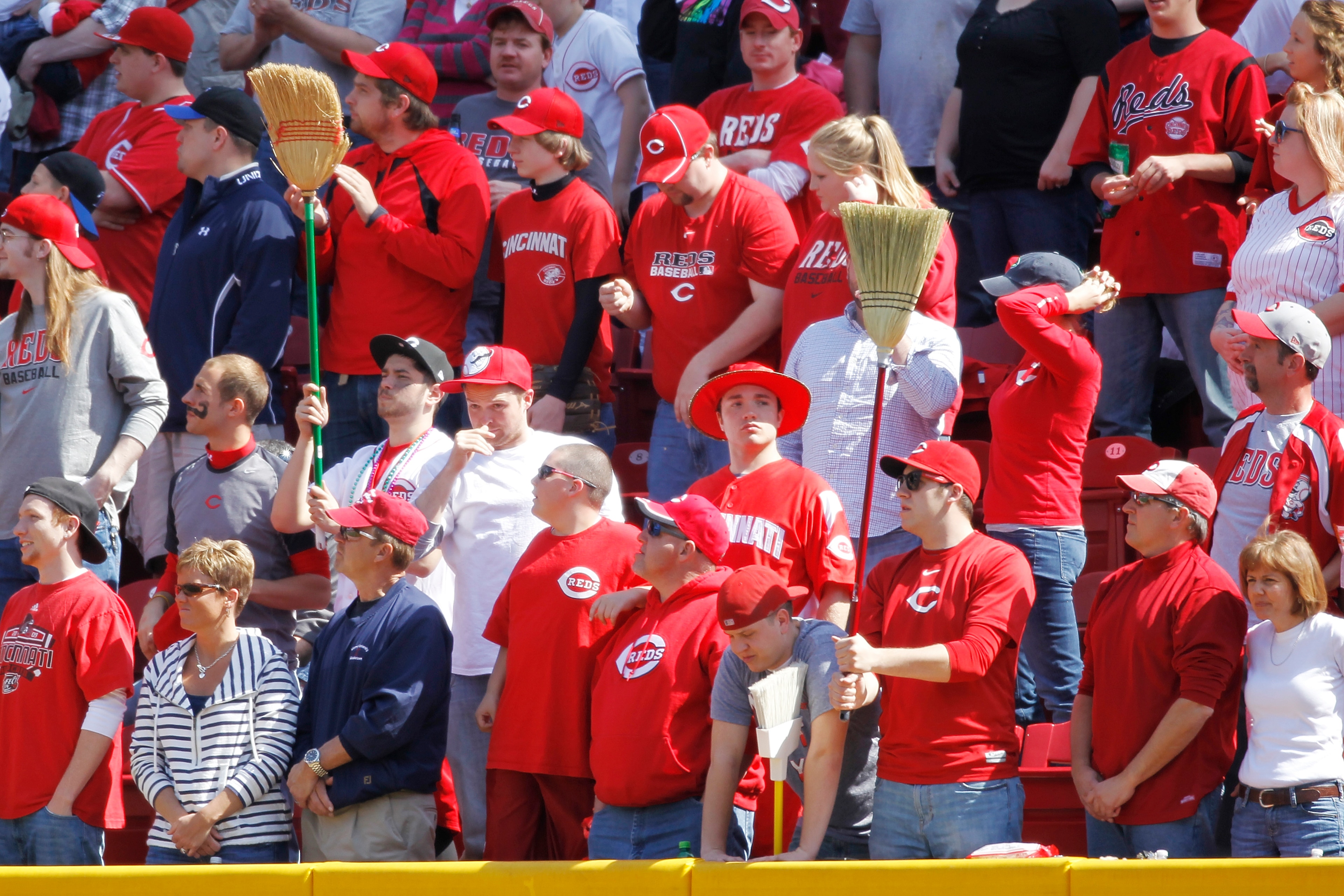 CINCINNATI, OH - APRIL 3: Cincinnati Reds fans hold up brooms late in the game against the Milwaukee Brewers at Great American Ball Park on April 3, 2011 in Cincinnati, Ohio. The Reds won 12-3 to finish off a three-game sweep. (Photo by Joe Robbins/Getty