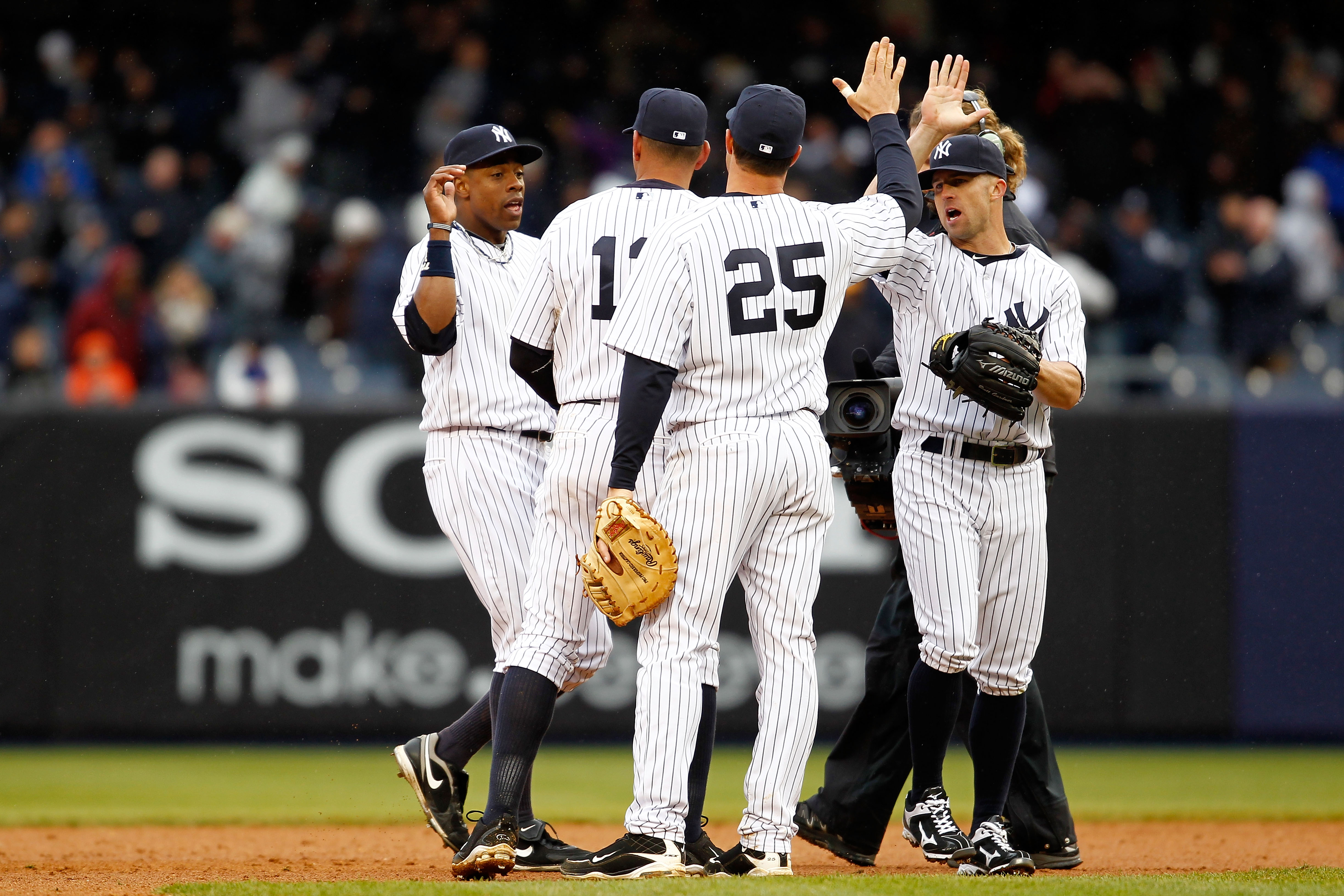 NEW YORK, NY - MARCH 31: Curtis Granderson #14, Alex Rodriguez #13, Mark Teixeira #25 and Brett Gardner #11 of the New York Yankees celebrate their 6-3 win over the Detroit Tigers on Opening Day at Yankee Stadium on March 31, 2011 in the Bronx borough of NEW YORK, NY - MARCH 31: Curtis Granderson #14, Alex Rodriguez #13, Mark Teixeira #25 and Brett Gardner #11 of the New York Yankees celebrate their 6-3 win over the Detroit Tigers on Opening Day at Yankee Stadium on March 31, 2011 in the Bronx borough of