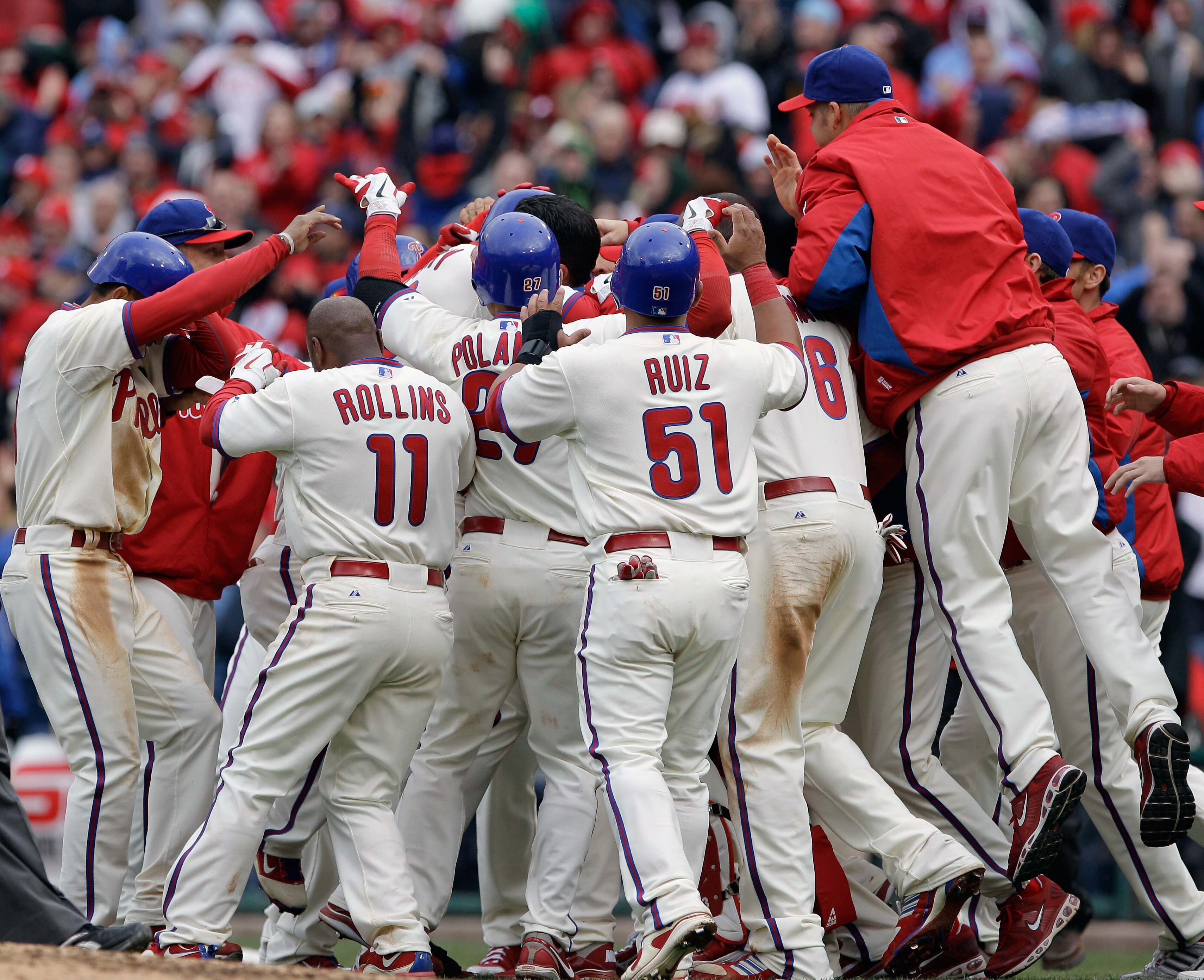 PHILADELPHIA, PA - APRIL 01: Members of the Philadelphia Phillies celebrate after defeating the Houston Astros 5-4 during opening day at Citizens Bank Park on April 1, 2011 in Philadelphia, Pennsylvania. (Photo by Rob Carr/Getty Images) PHILADELPHIA, PA - APRIL 01: Members of the Philadelphia Phillies celebrate after defeating the Houston Astros 5-4 during opening day at Citizens Bank Park on April 1, 2011 in Philadelphia, Pennsylvania. (Photo by Rob Carr/Getty Images)
