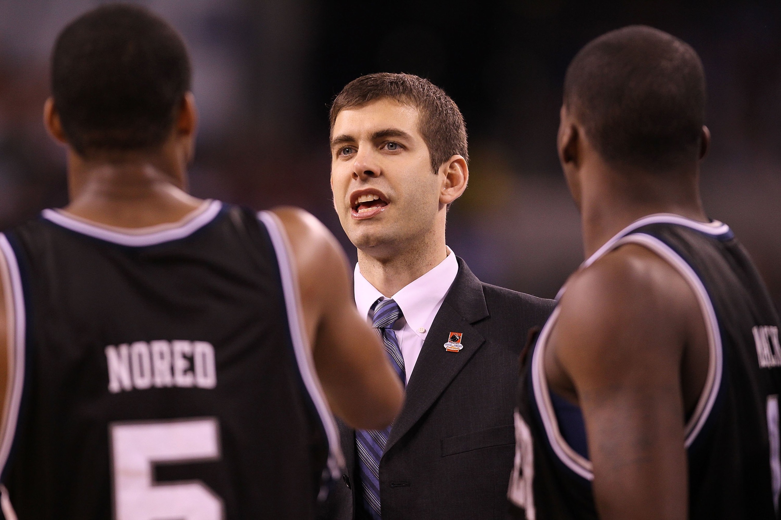 INDIANAPOLIS - APRIL 03:  Head coach Brad Stevens of the Butler Bulldogs talks with his team while taking on the Michigan State Spartans during the National Semifinal game of the 2010 NCAA Division I Men's Basketball Championship on April 3, 2010 in India