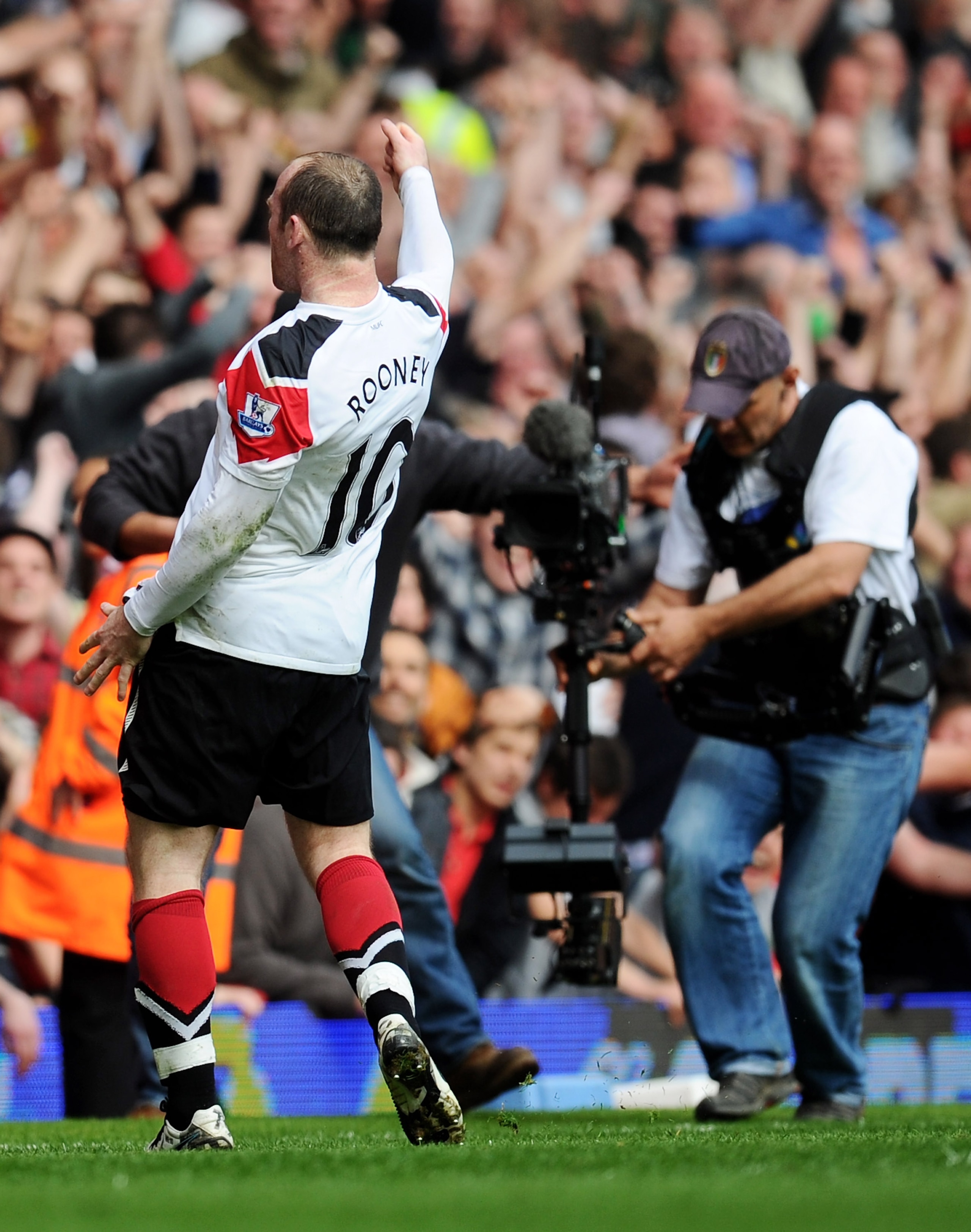 LONDON, ENGLAND - APRIL 02:  Wayne Rooney of Manchester United celebrates his hat trick goal from the penalty spot during the Barclays Premier League match between West Ham United and Manchester United at the Boleyn Ground on April 2, 2011 in London, Engl