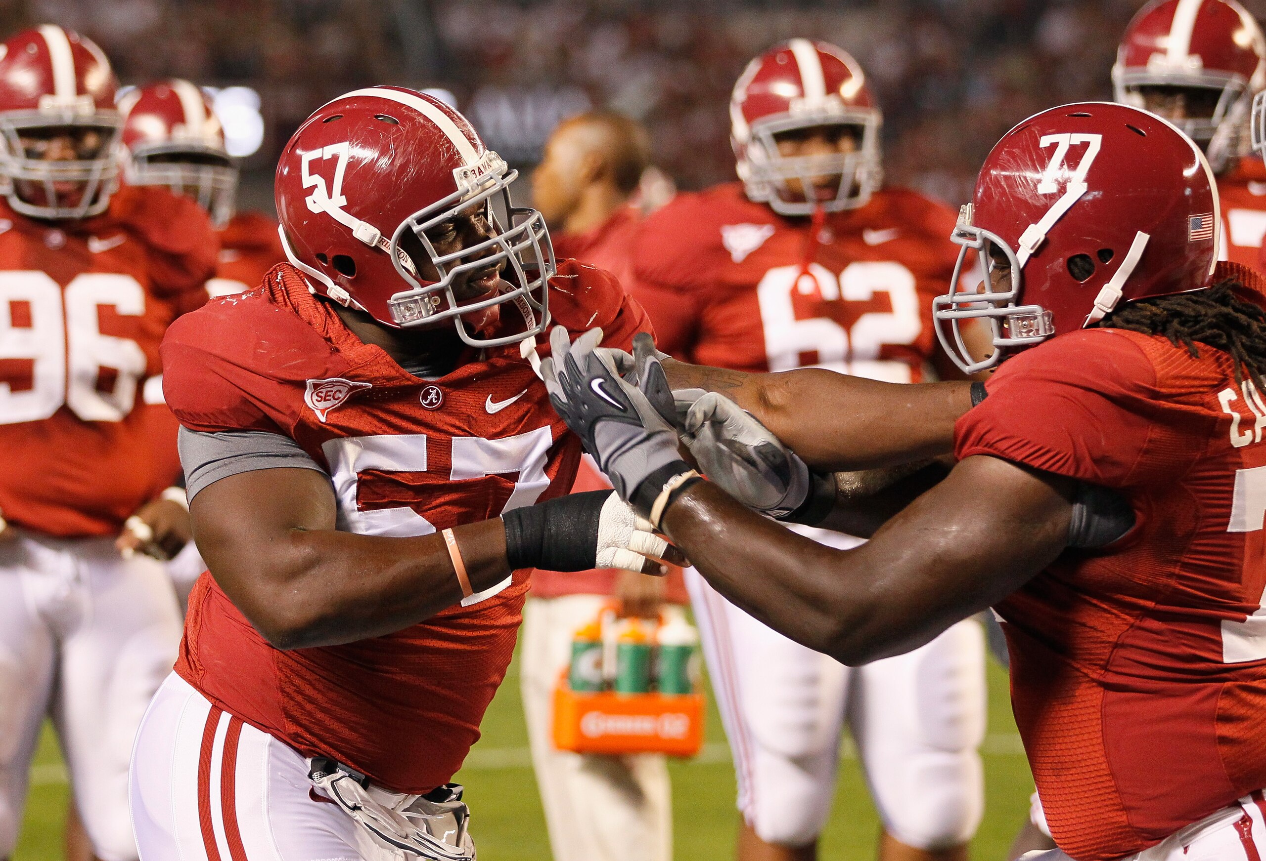 TUSCALOOSA, AL - OCTOBER 16: Marcell Dareus #57 and James Carpenter #77 of the Alabama Crimson Tide against the Ole Miss Rebels at Bryant-Denny Stadium on October 16, 2010 in Tuscaloosa, Alabama. (Photo by Kevin C. Cox/Getty Images) TUSCALOOSA, AL - OCTOBER 16: Marcell Dareus #57 and James Carpenter #77 of the Alabama Crimson Tide against the Ole Miss Rebels at Bryant-Denny Stadium on October 16, 2010 in Tuscaloosa, Alabama. (Photo by Kevin C. Cox/Getty Images)