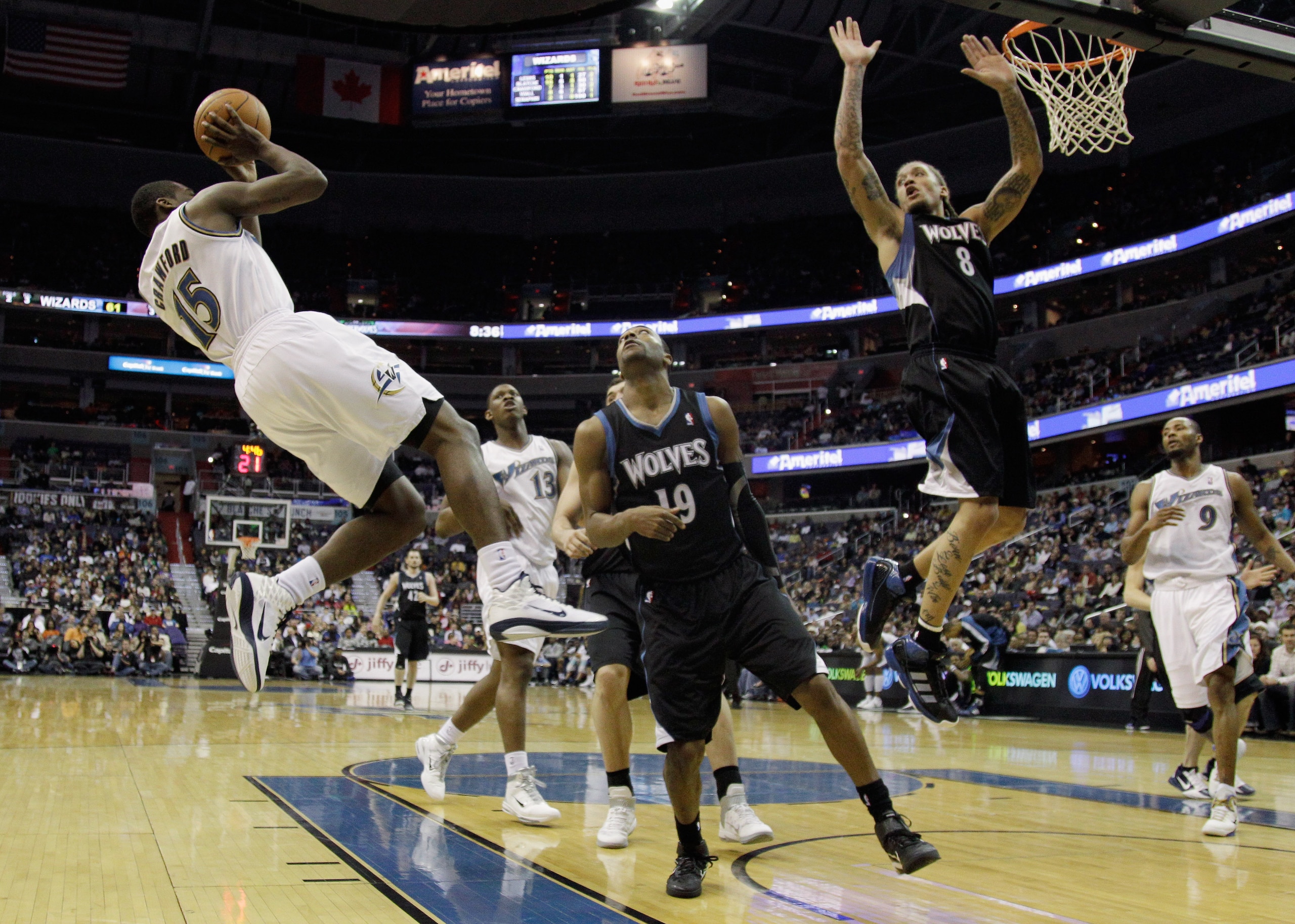 WASHINGTON, DC - MARCH 05:  Jordan Crawford #15 of the Washington Wizards puts up a shot in front of Wayne Ellington #19 and Michael Beasley #8 of the Minnesota Timberwolves at the Verizon Center on March 5, 2011 in Washington, DC. NOTE TO USER: User expr