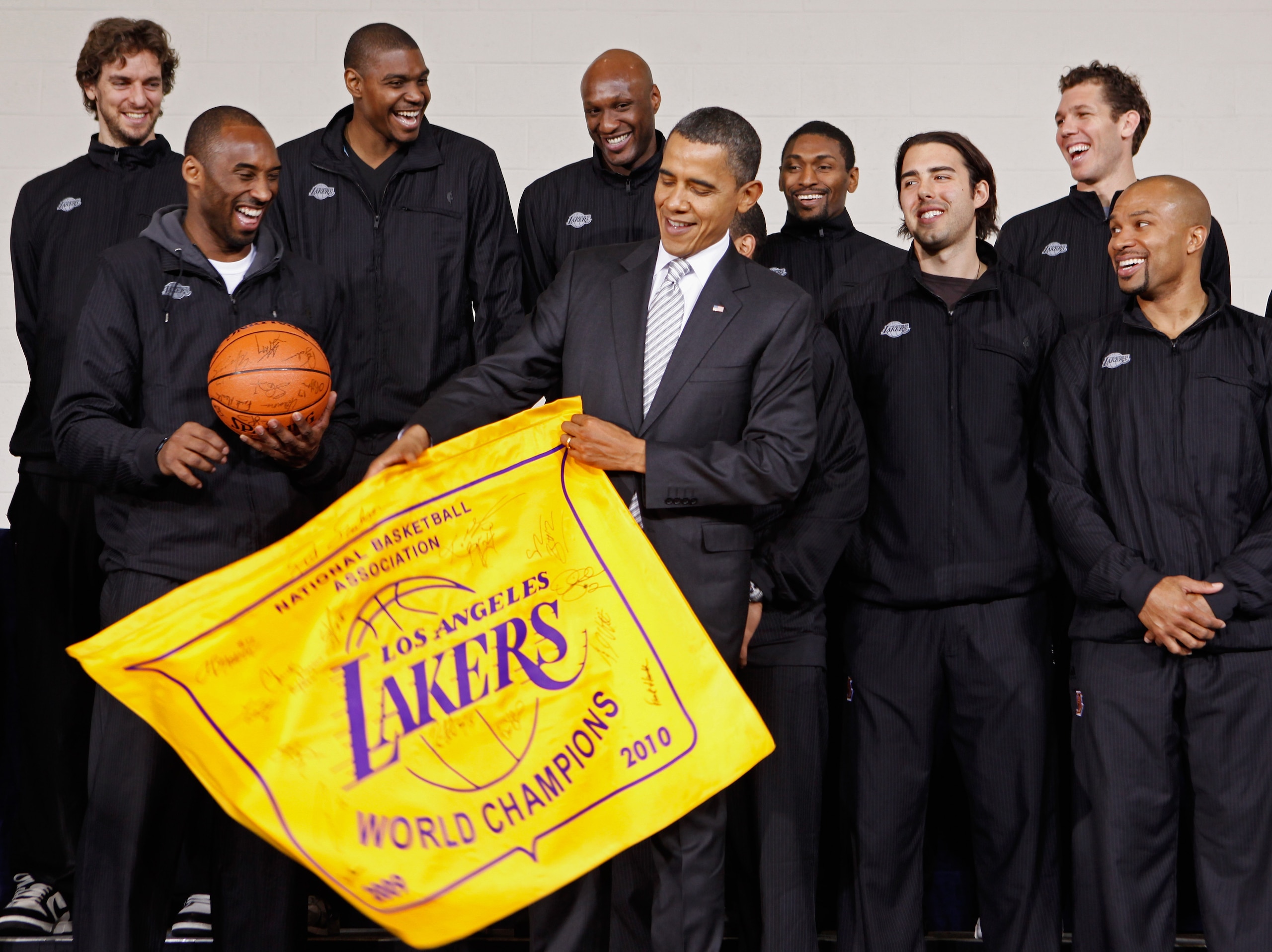 WASHINGTON, DC - DECEMBER 13: (AFP OUT) U.S. President Barack Obama (C) receives an autographed championship flag and basketball from members of the Los Angeles Lakers (L-R) Paul Gasol, Kobe Bryant, Andrew Bynum, Lamar Odom, Ron Artest, Aleksandar Vujaci WASHINGTON, DC - DECEMBER 13: (AFP OUT) U.S. President Barack Obama (C) receives an autographed championship flag and basketball from members of the Los Angeles Lakers (L-R) Paul Gasol, Kobe Bryant, Andrew Bynum, Lamar Odom, Ron Artest, Aleksandar Vujaci