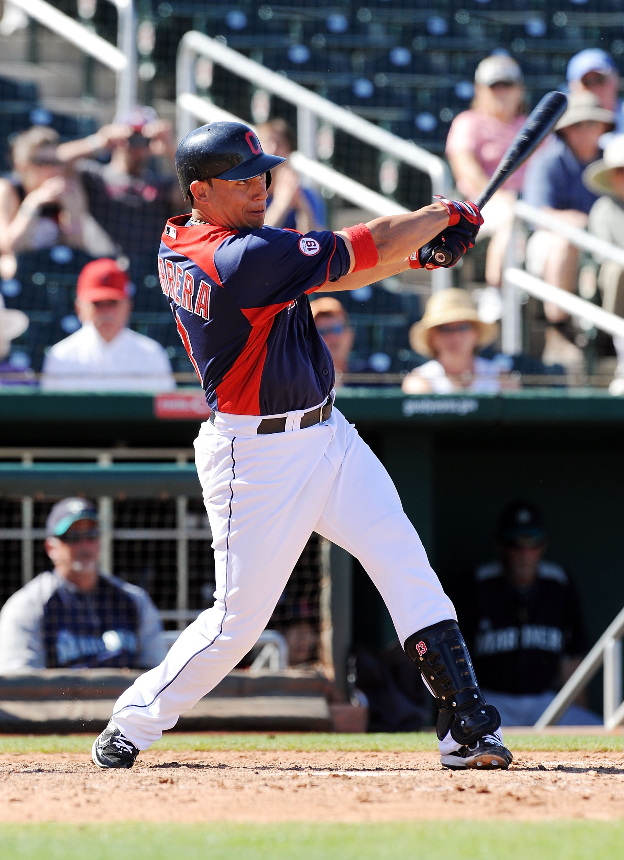 GOODYEAR, AZ - MARCH 11:  Asdrubal Cabrera #13 of the Cleveland Indians follows through on a swing against the Seattle Mariners at Goodyear Ballpark on March 11, 2011 in Goodyear, Arizona.  (Photo by Norm Hall/Getty Images)