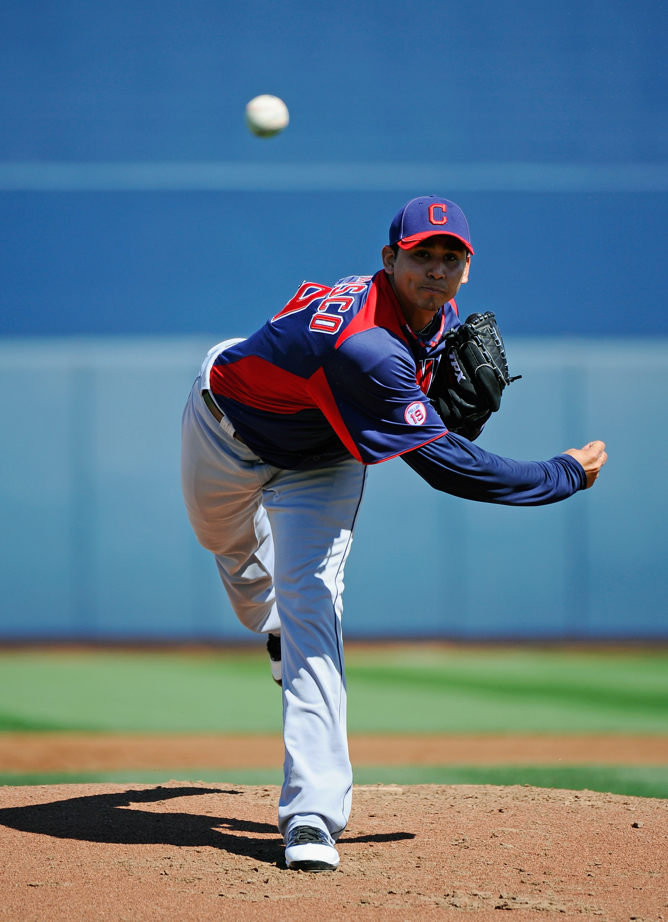 PEORIA, AZ - MARCH 13:  Pitcher Carlos Carrasco #59 of the Cleveland Indians throws a pitch against the San Diego Padres during the spring training baseball game at Peoria Stadium on March 13, 2011 in Peoria, Arizona.  (Photo by Kevork Djansezian/Getty Im
